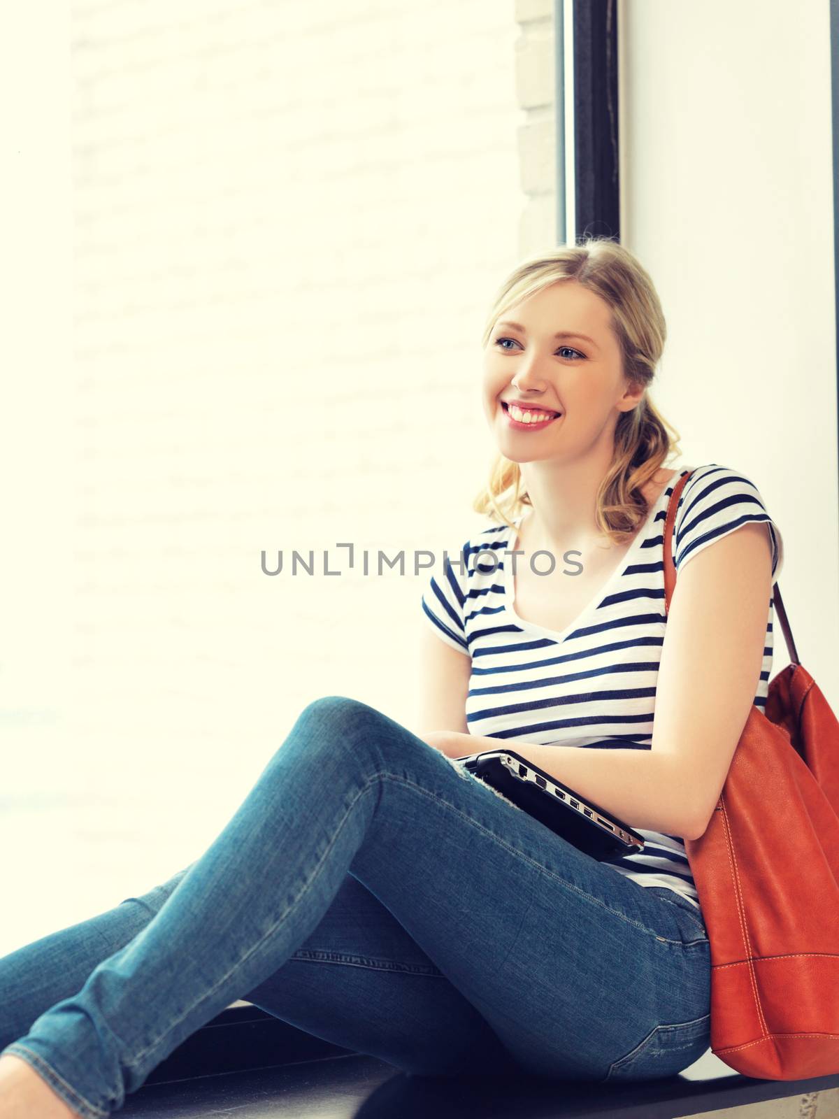 picture of happy and smiling teenage girl with laptop