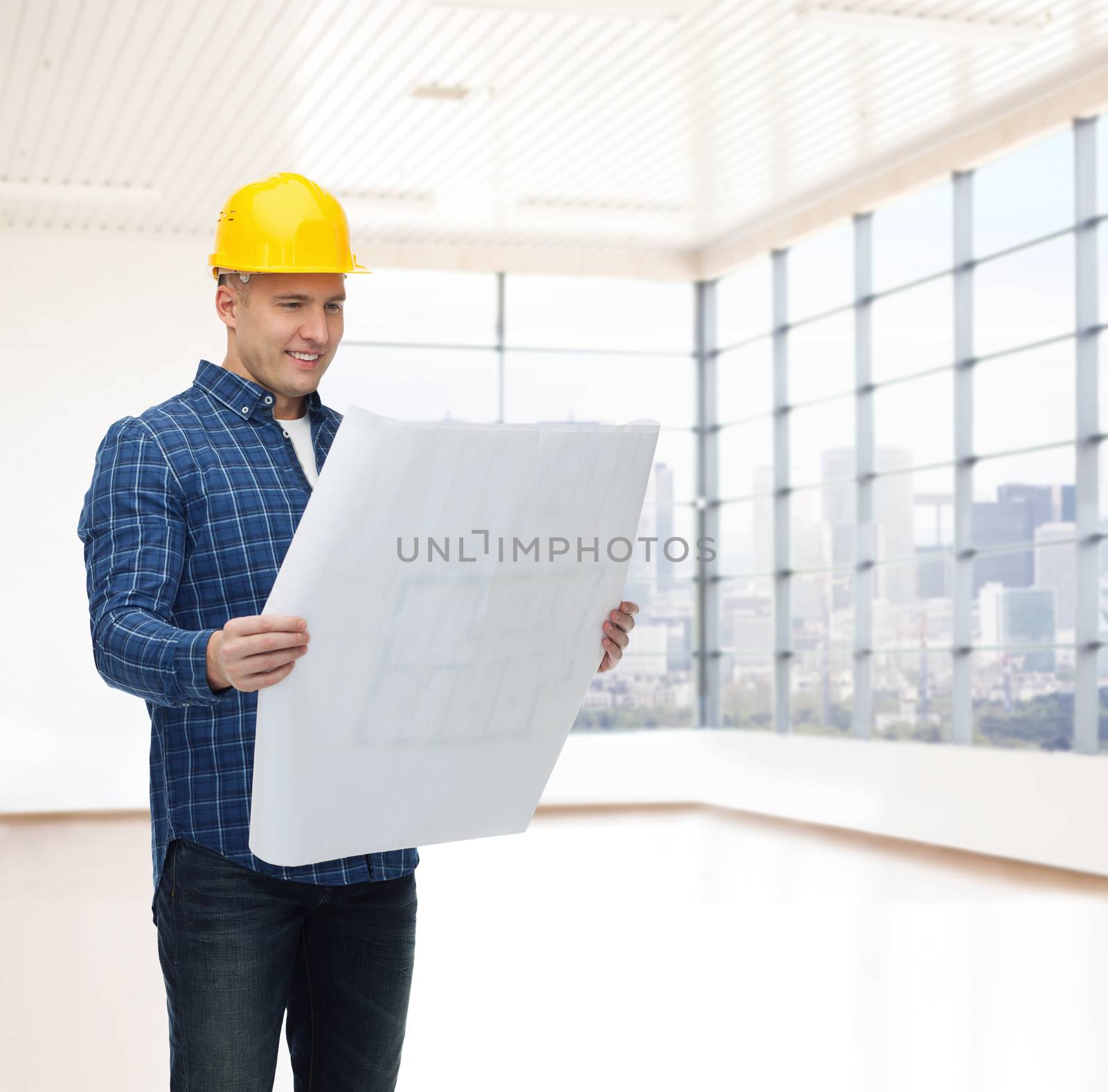 smiling male builder in helmet with blueprint by dolgachov