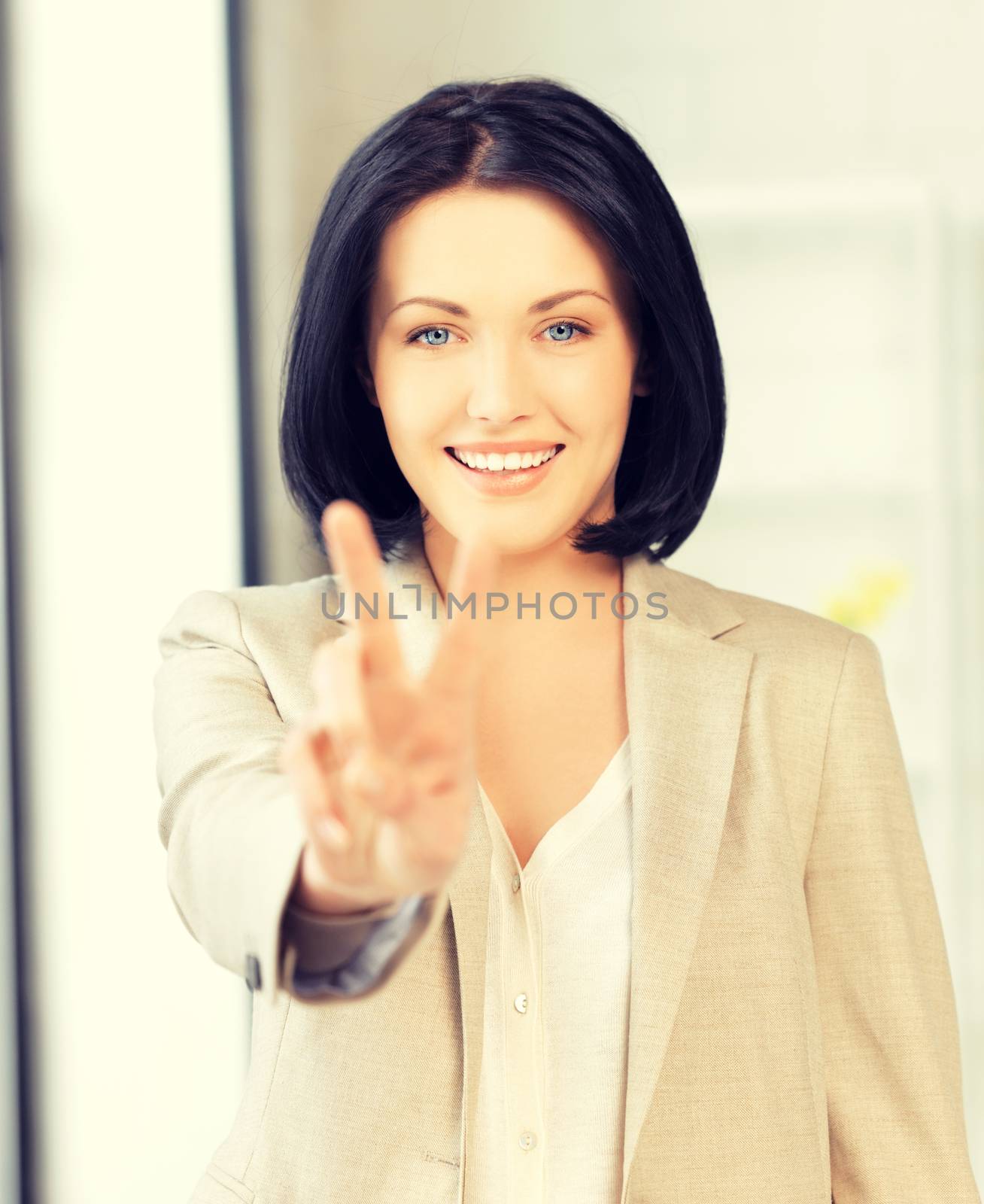 bright picture of young woman showing victory sign