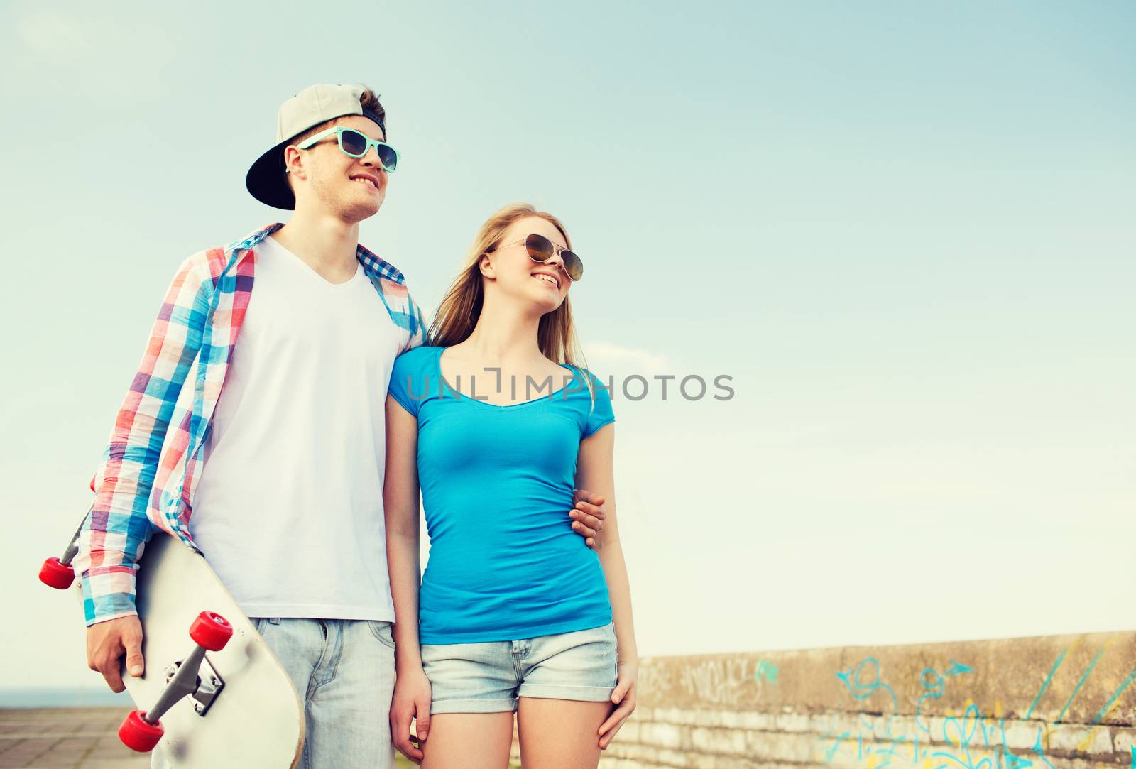 smiling couple having fun outdoors by dolgachov