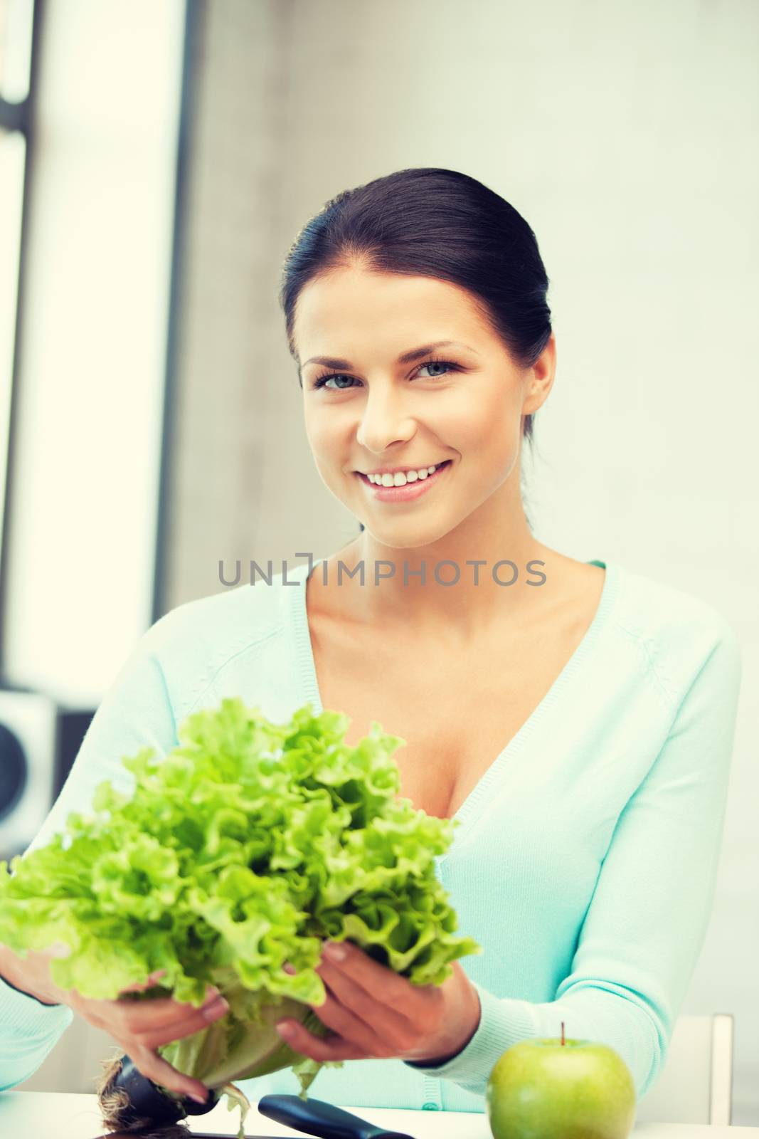 beautiful woman in the kitchen by dolgachov