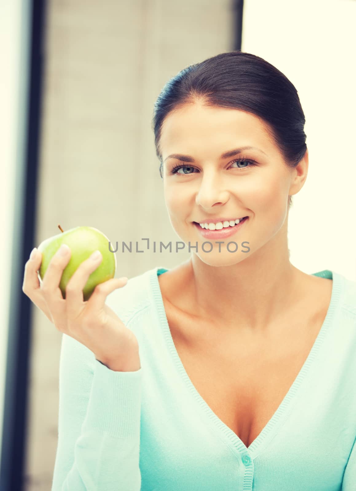 bright picture of lovely housewife with green apple