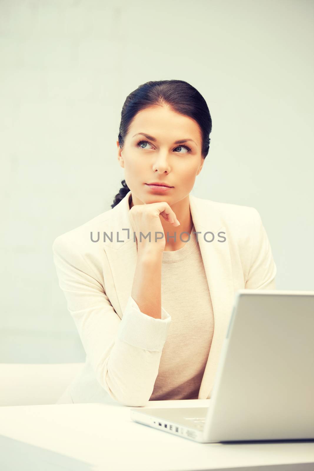 pensive woman with laptop computer by dolgachov