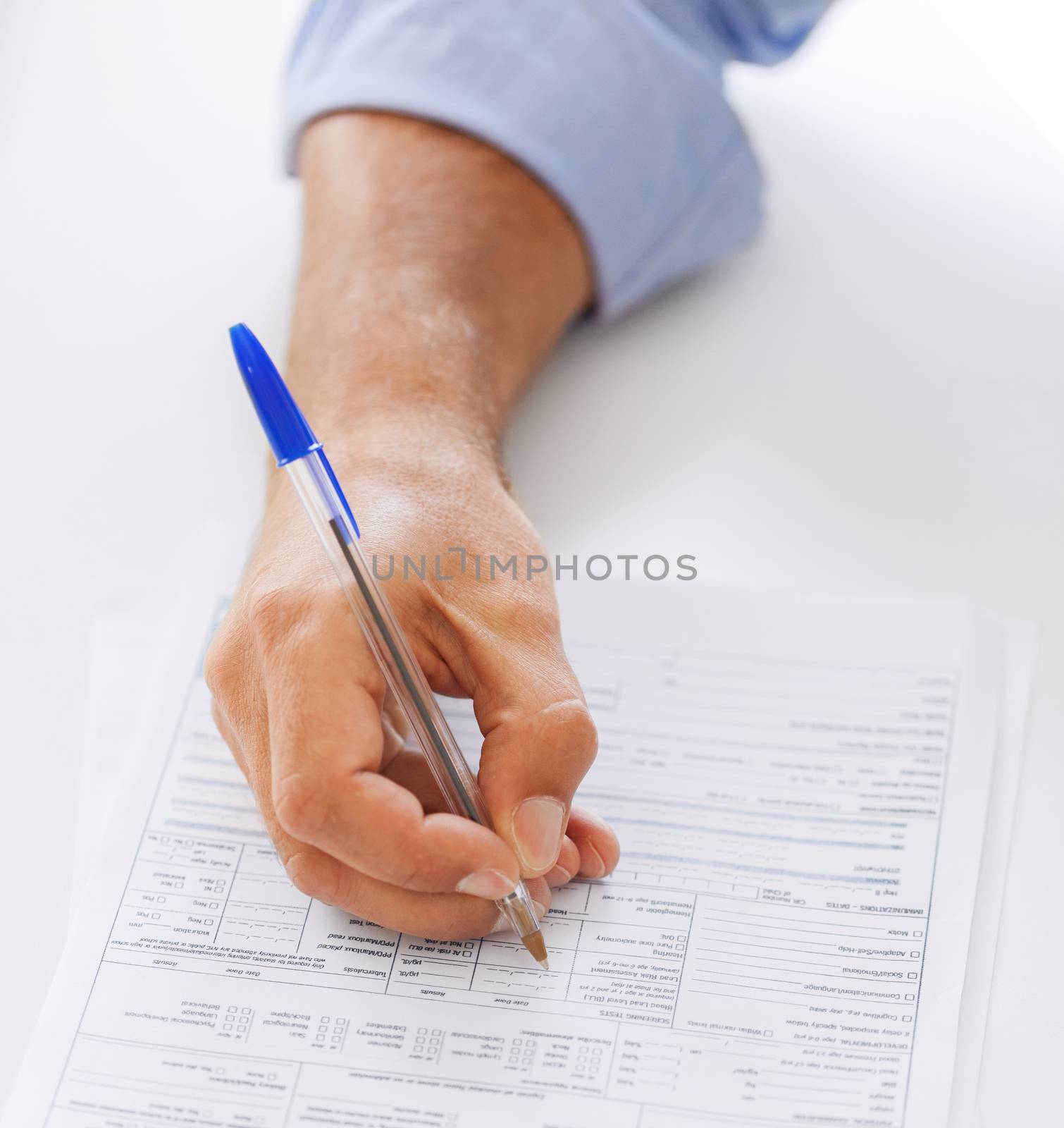 business, office, school and education concept - man filling tax form