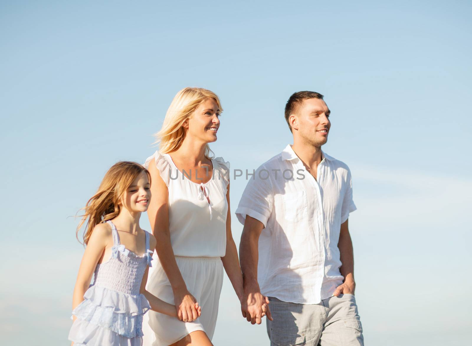 summer holidays, children and people concept - happy family at the seaside