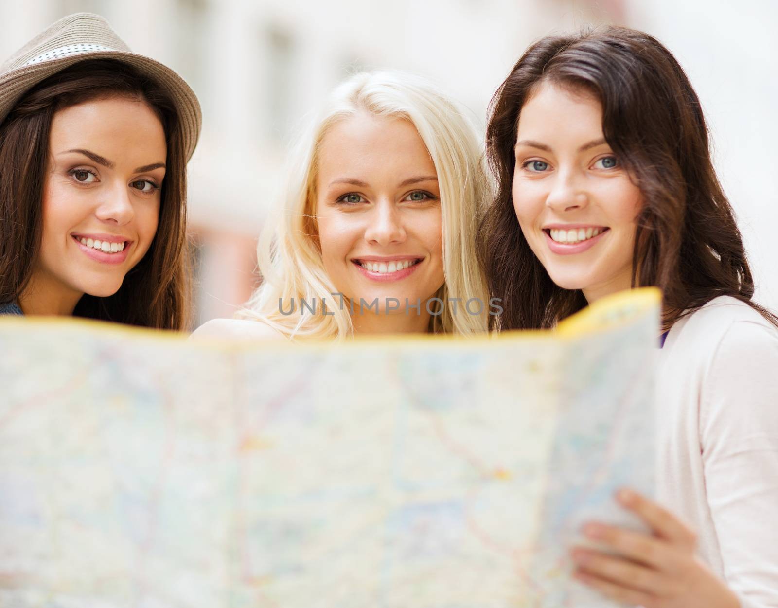 beautiful girls with map in the city by dolgachov