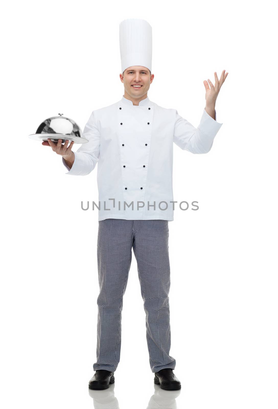 happy male chef cook holding cloche by dolgachov