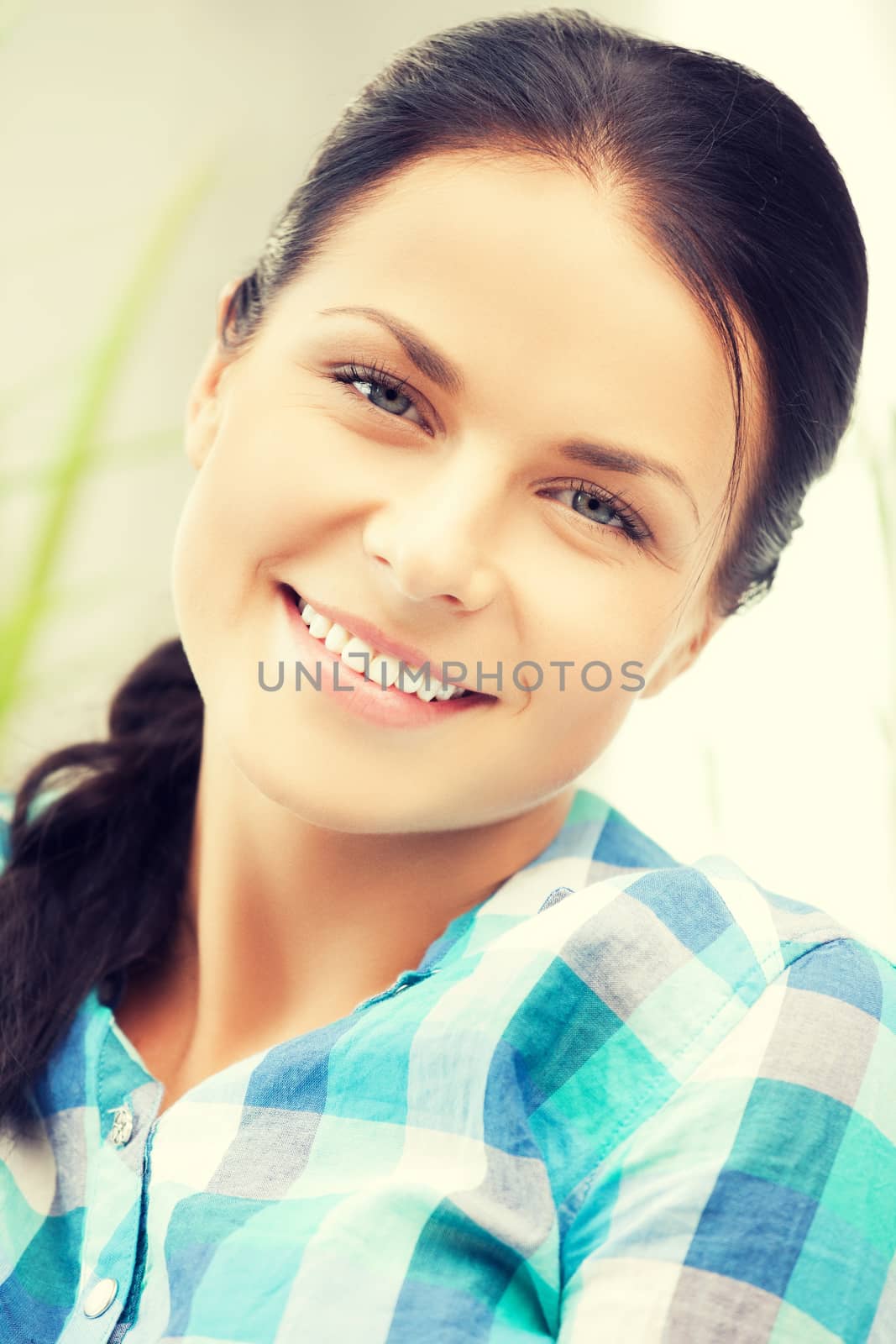 bright closeup picture of smiling woman at home