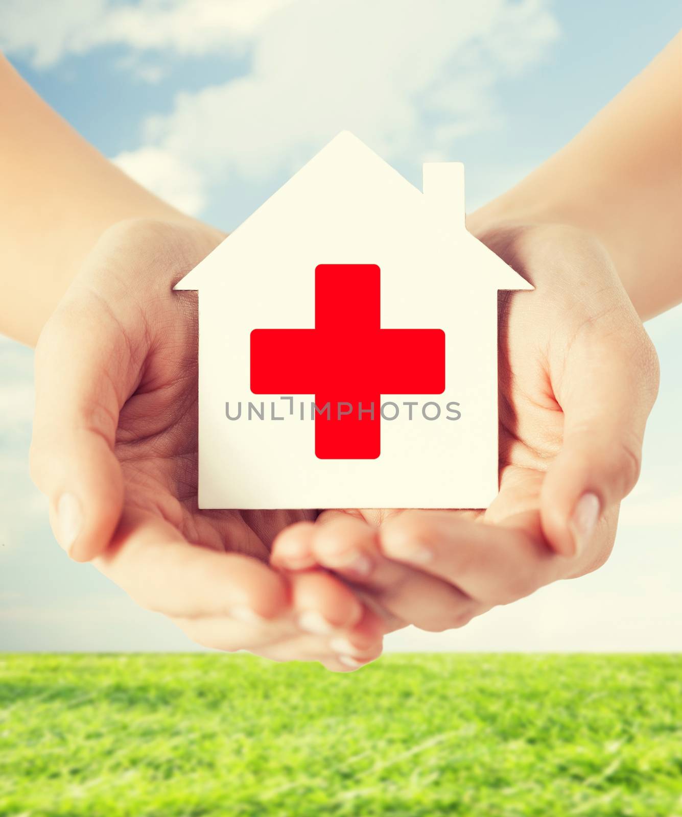 hands holding paper house with red cross by dolgachov