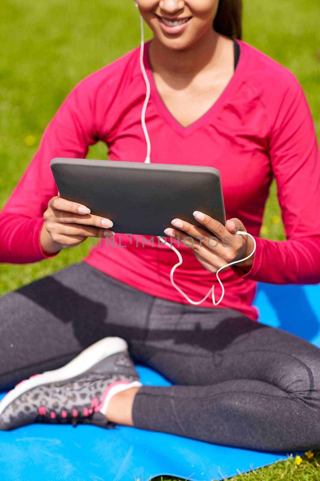 close up of smiling woman with tablet pc outdoors by dolgachov