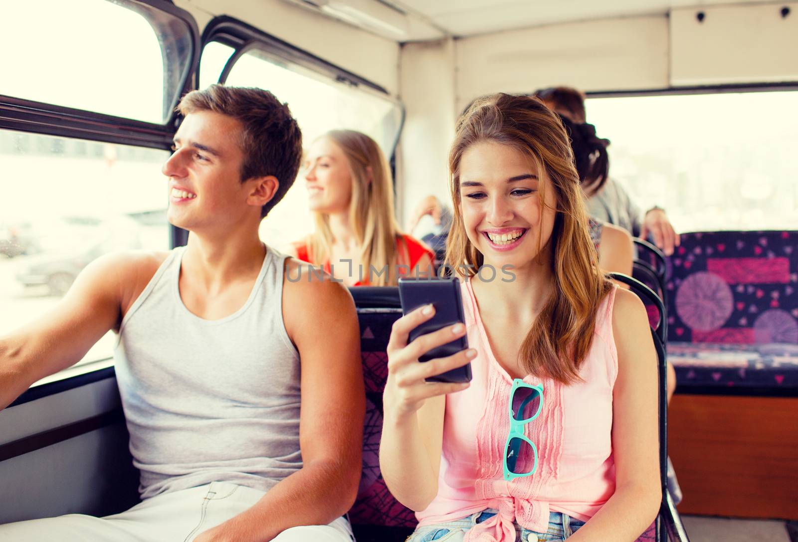 smiling couple with smartphone making selfie by dolgachov