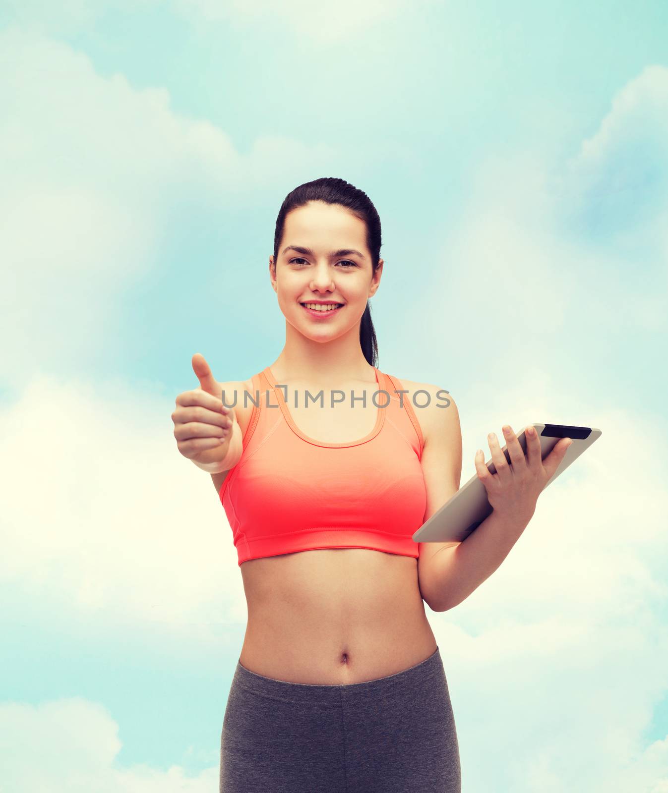 sport, exercise, technology, internet and healthcare - sporty woman with tablet pc computer showing thumbs up