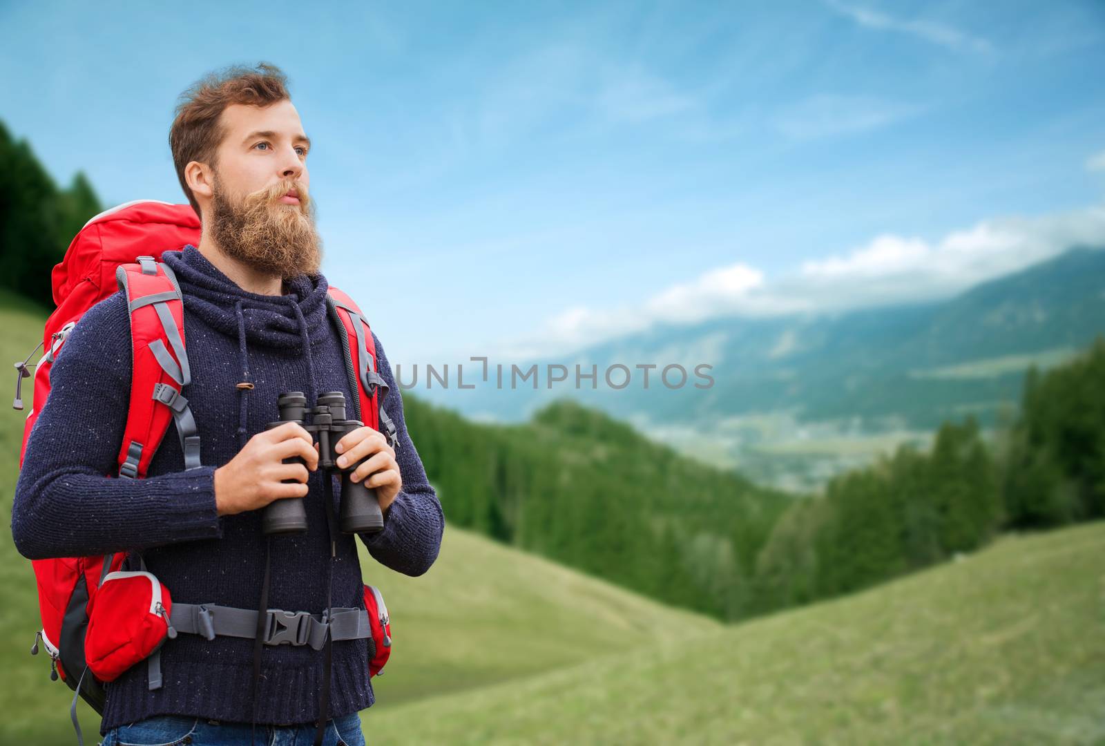 adventure, travel, tourism, hike and people concept - man with red backpack and binocular over alpine hills background