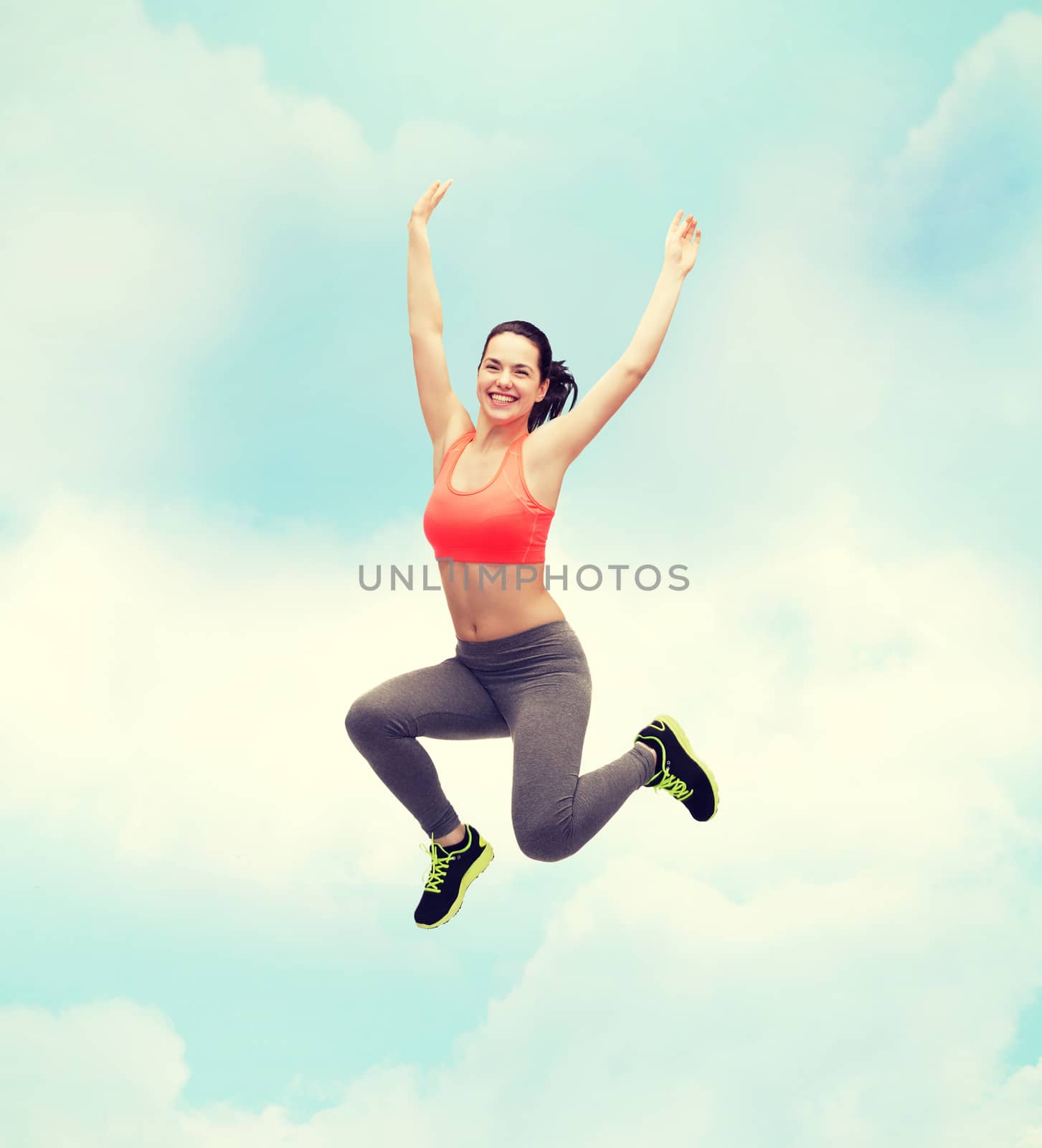 sporty teenage girl jumping in sportswear by dolgachov