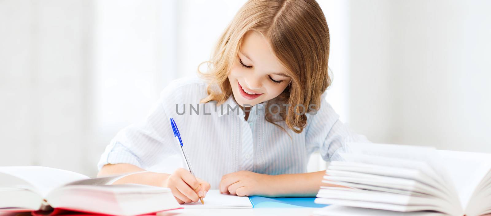 student girl studying at school by dolgachov
