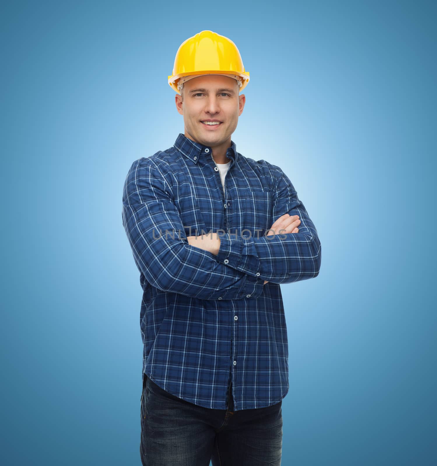 repair, construction, building, people and maintenance concept - smiling male builder or manual worker in helmet over blue background