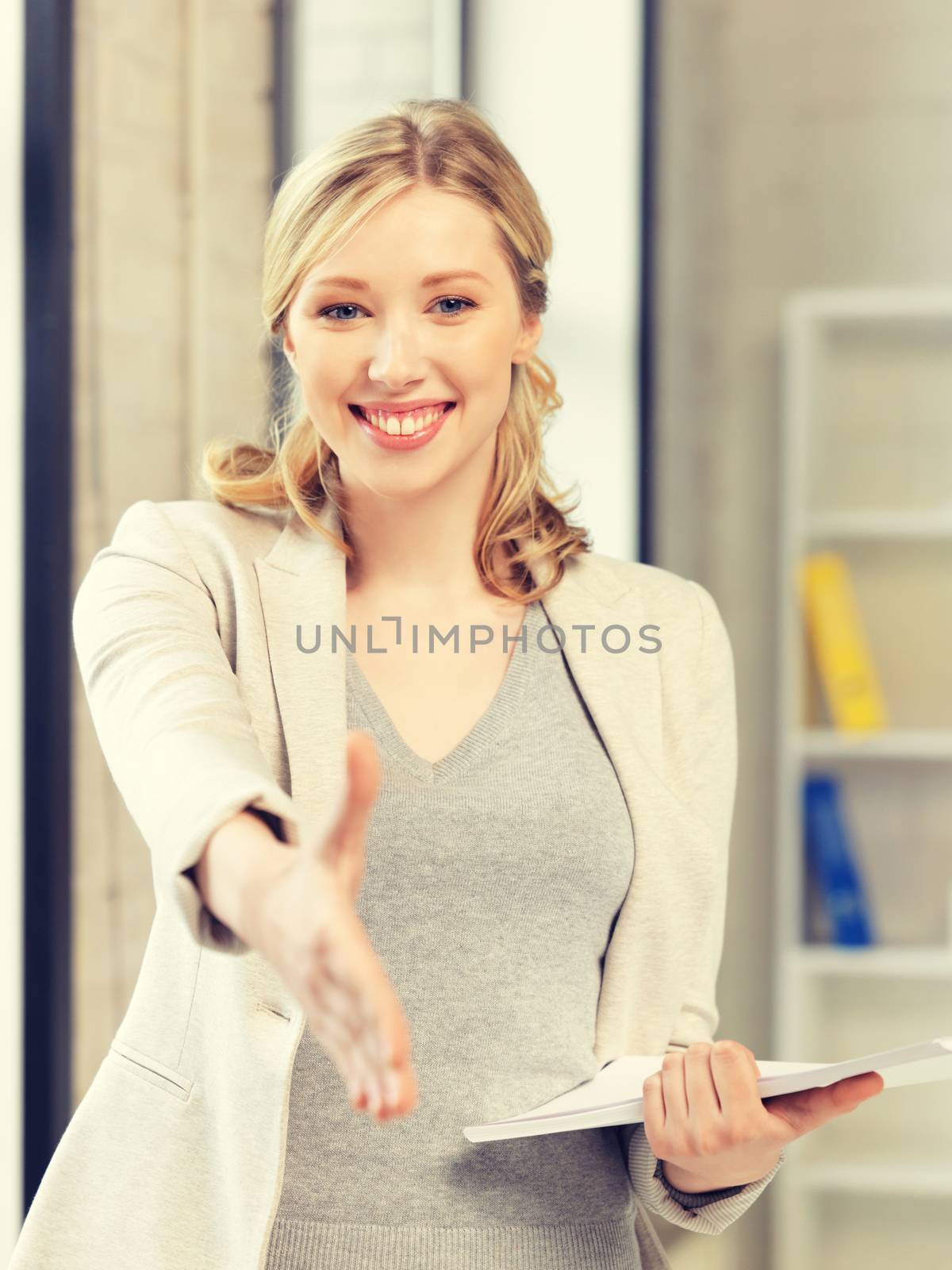 lovely woman with an open hand ready for handshake