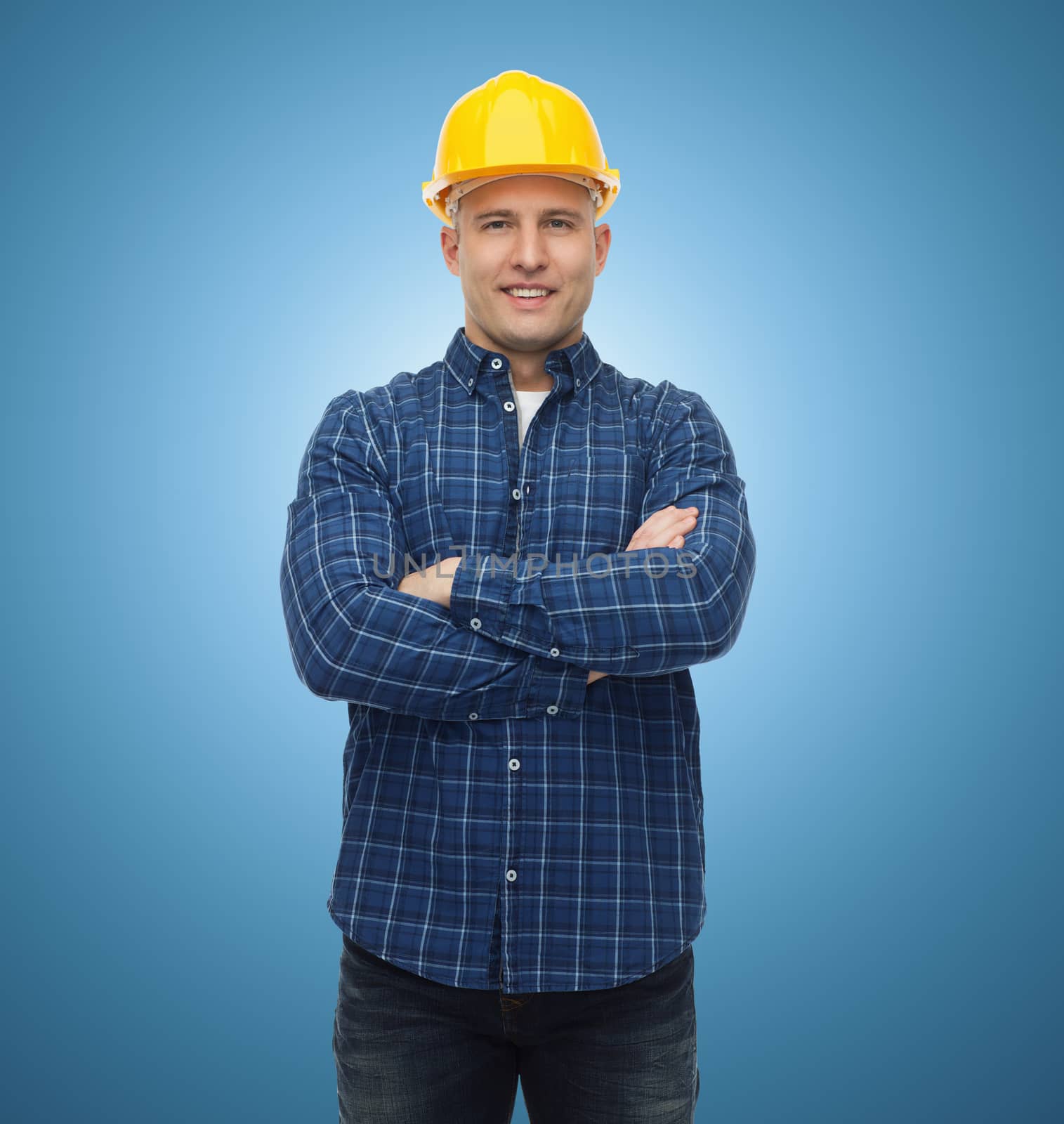repair, construction, building, people and maintenance concept - smiling male builder or manual worker in helmet over blue background