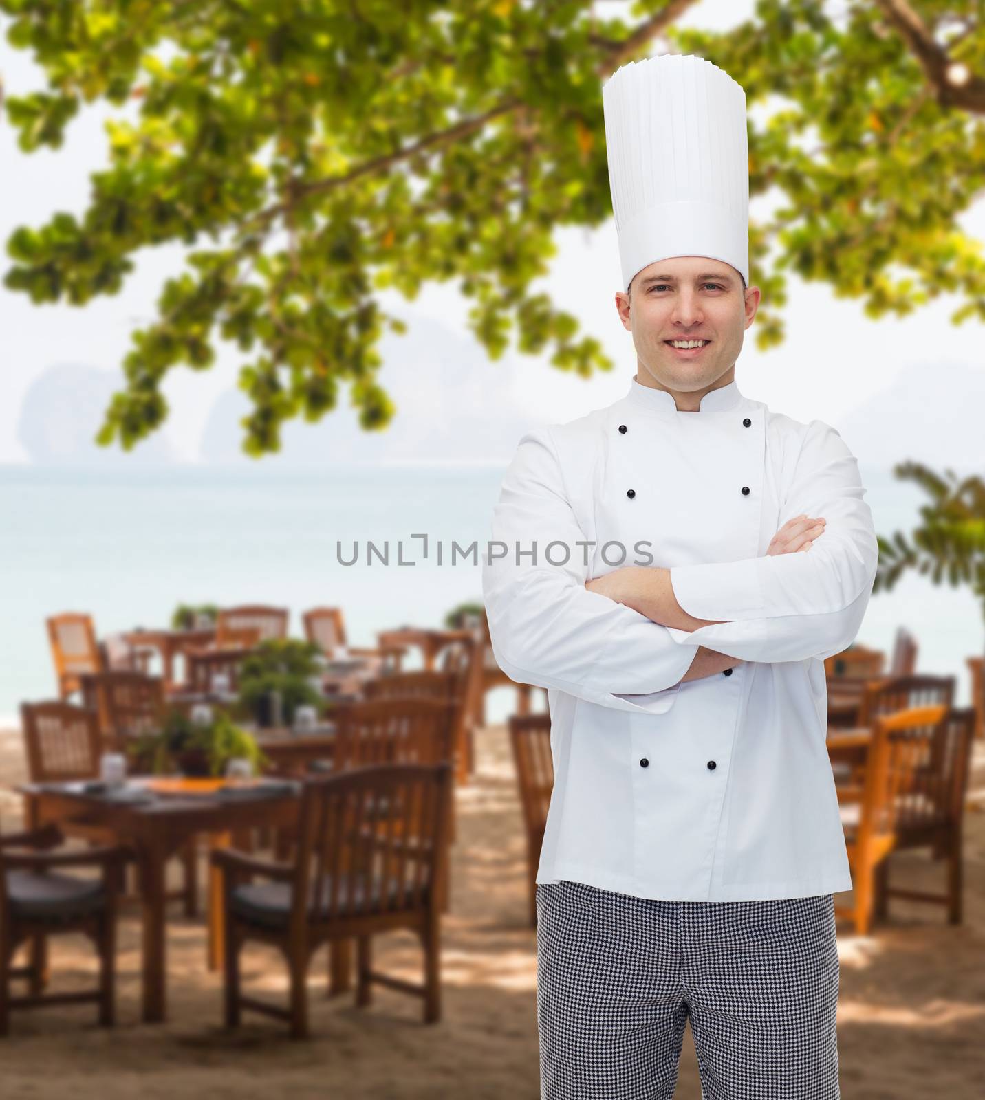 happy male chef cook with crossed hands by dolgachov