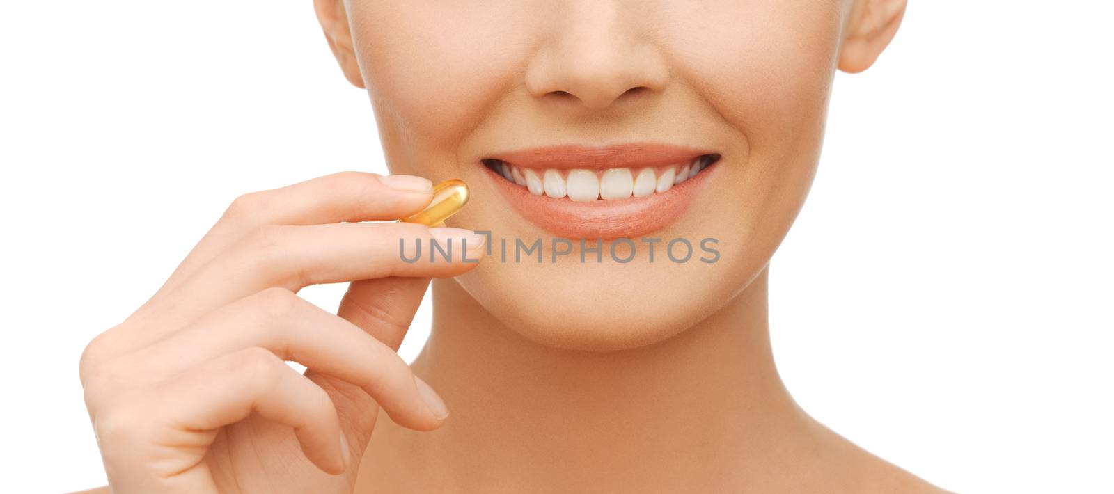 beautiful woman with omega 3 vitamins by dolgachov