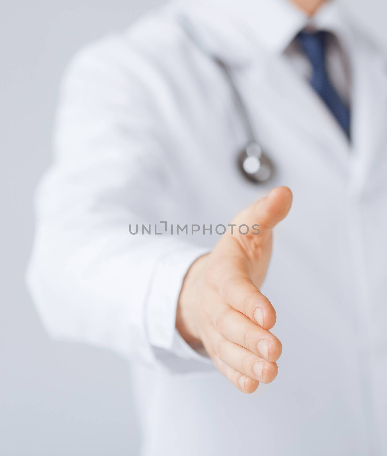 male doctor with open hand ready for hugging by dolgachov