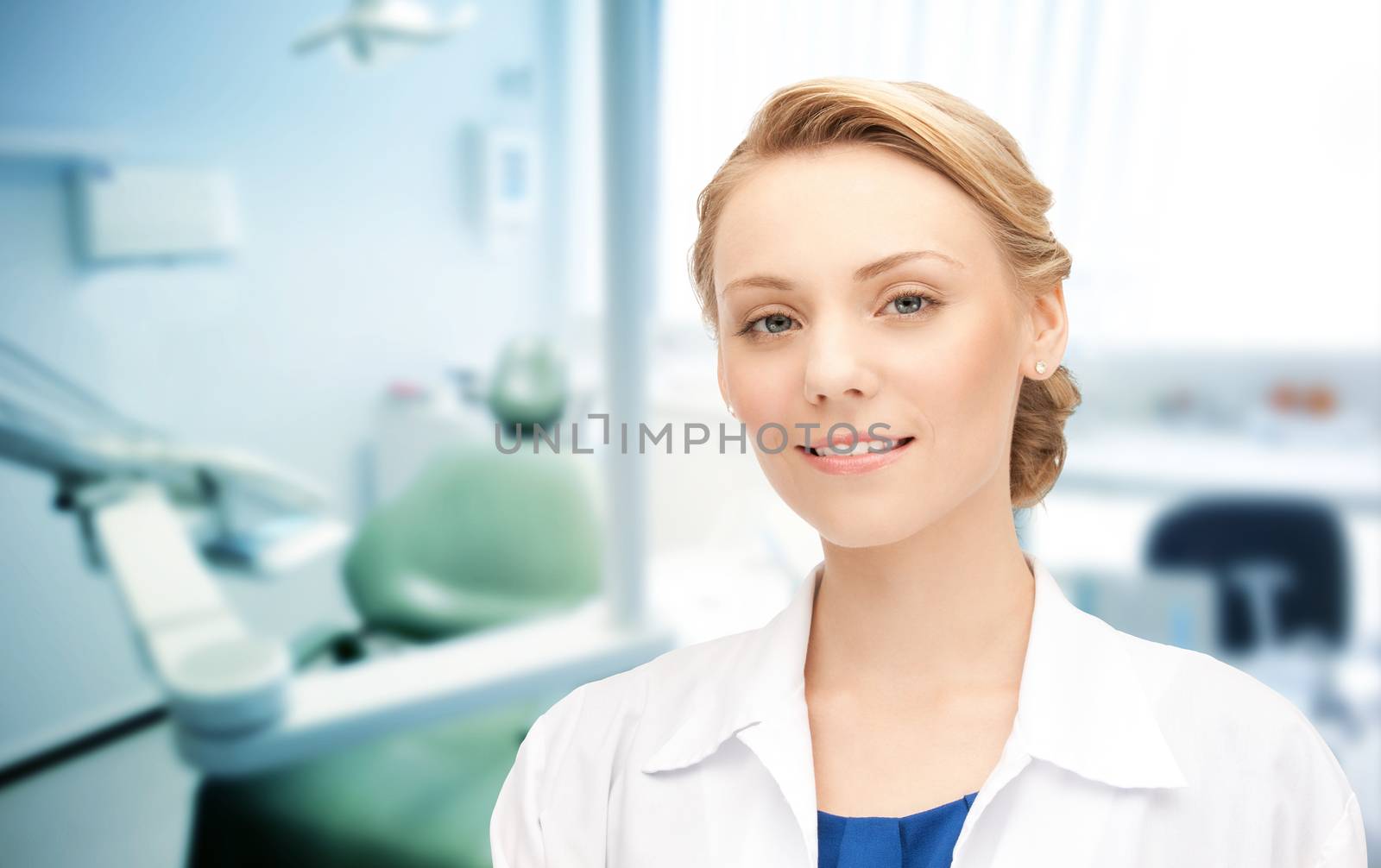 happy young female dentist with tools by dolgachov