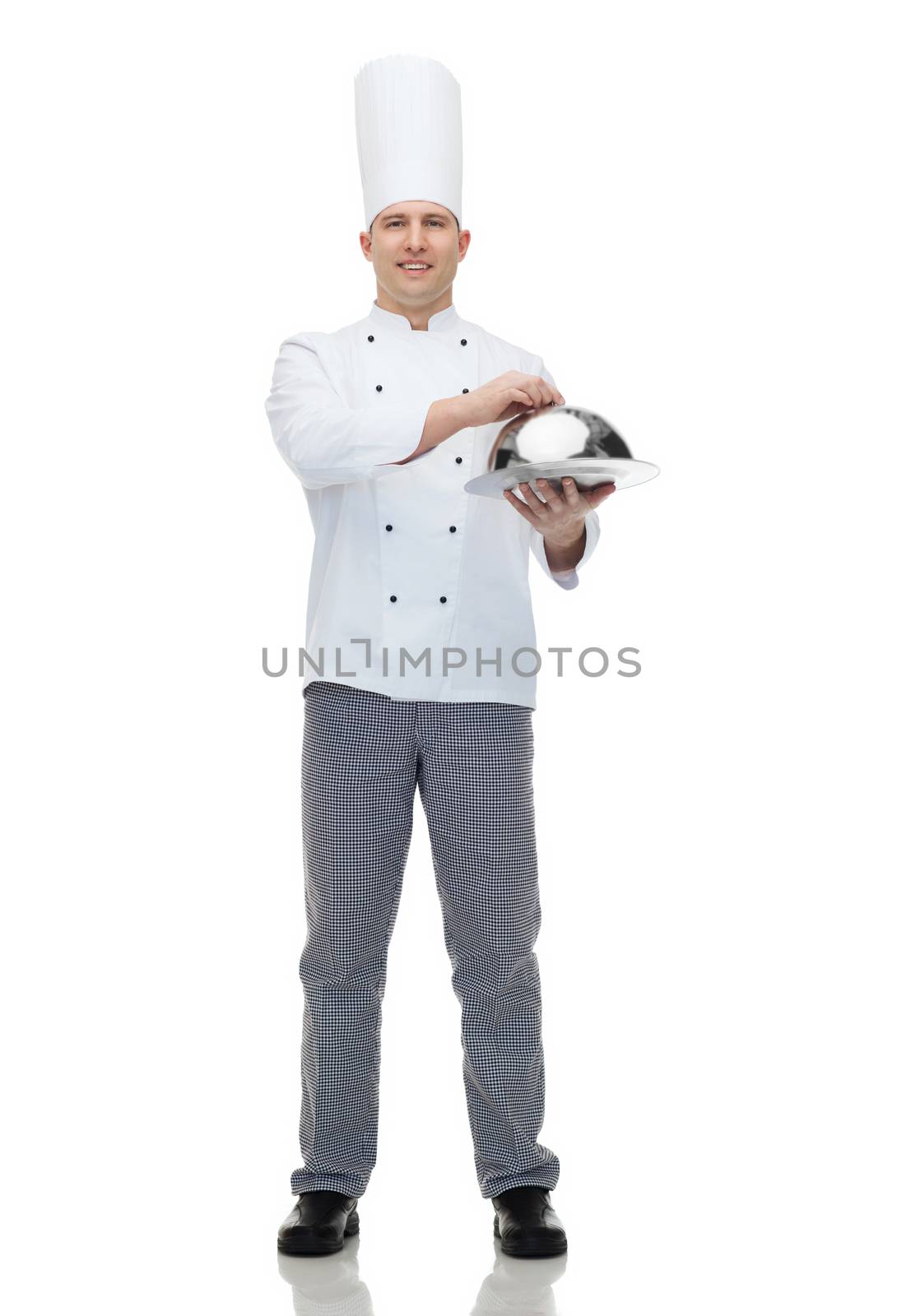 happy male chef cook holding cloche by dolgachov