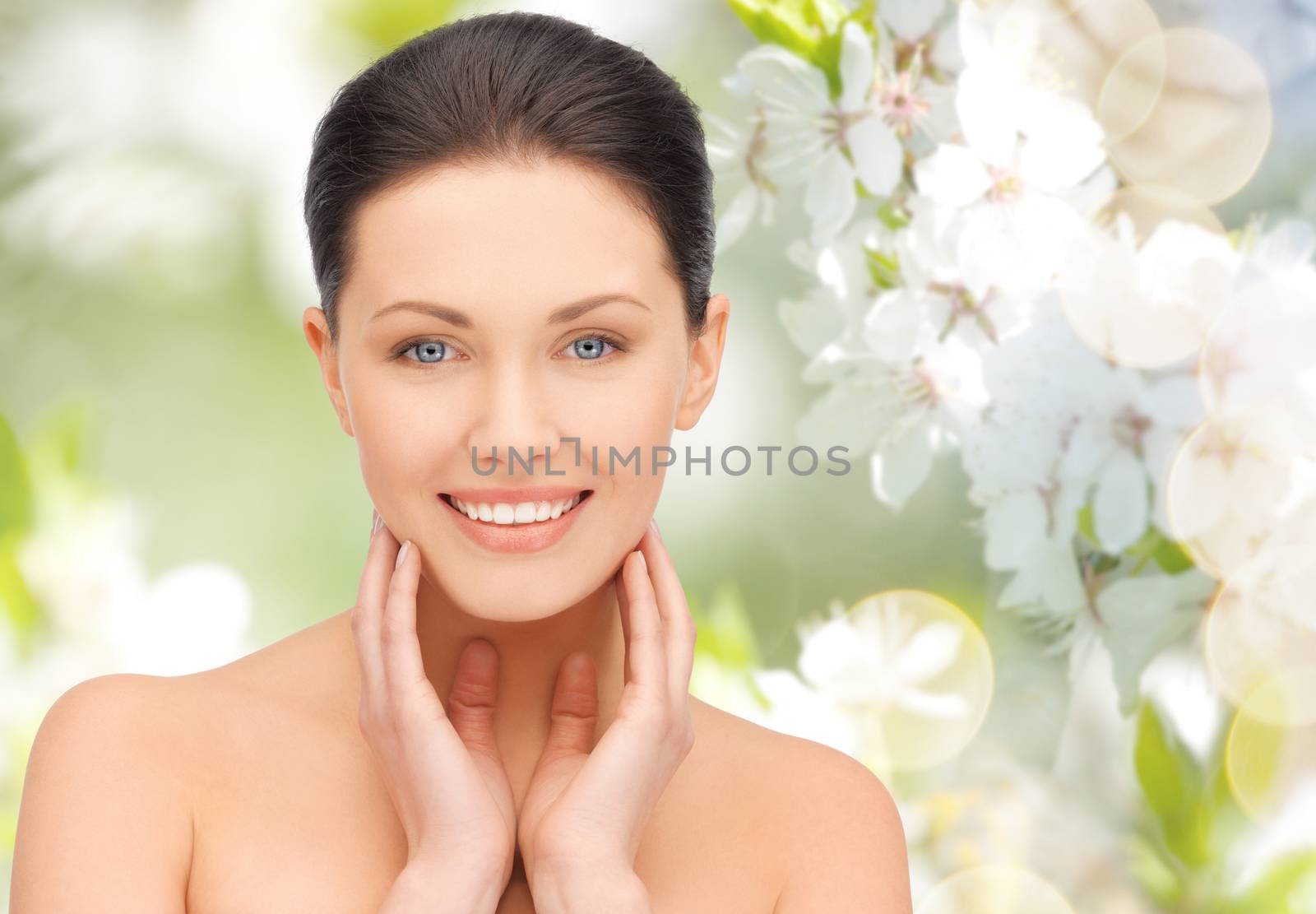 beautiful young woman touching her face and neck by dolgachov