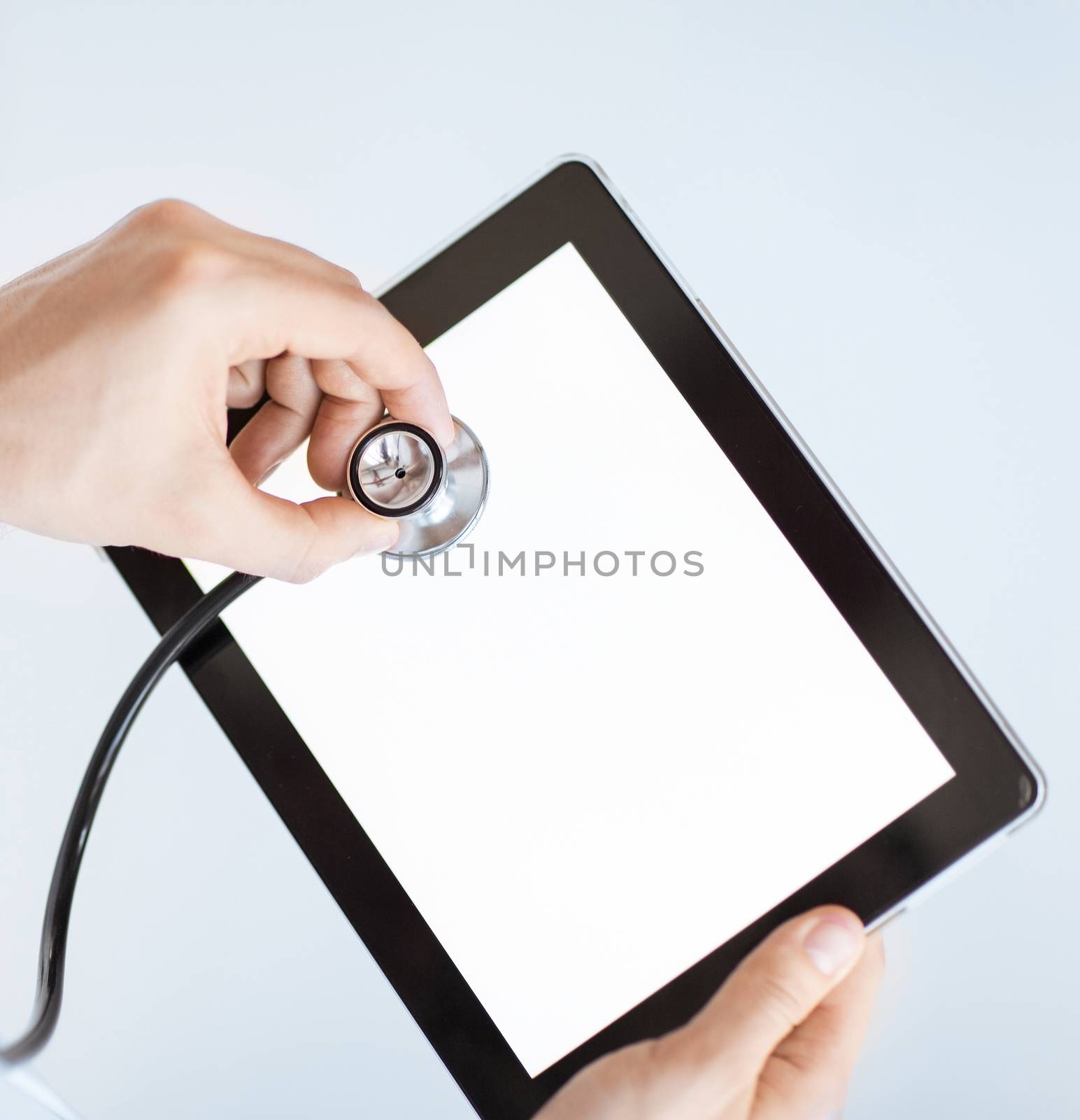 close up of male doctor with stethoscope and tablet pc