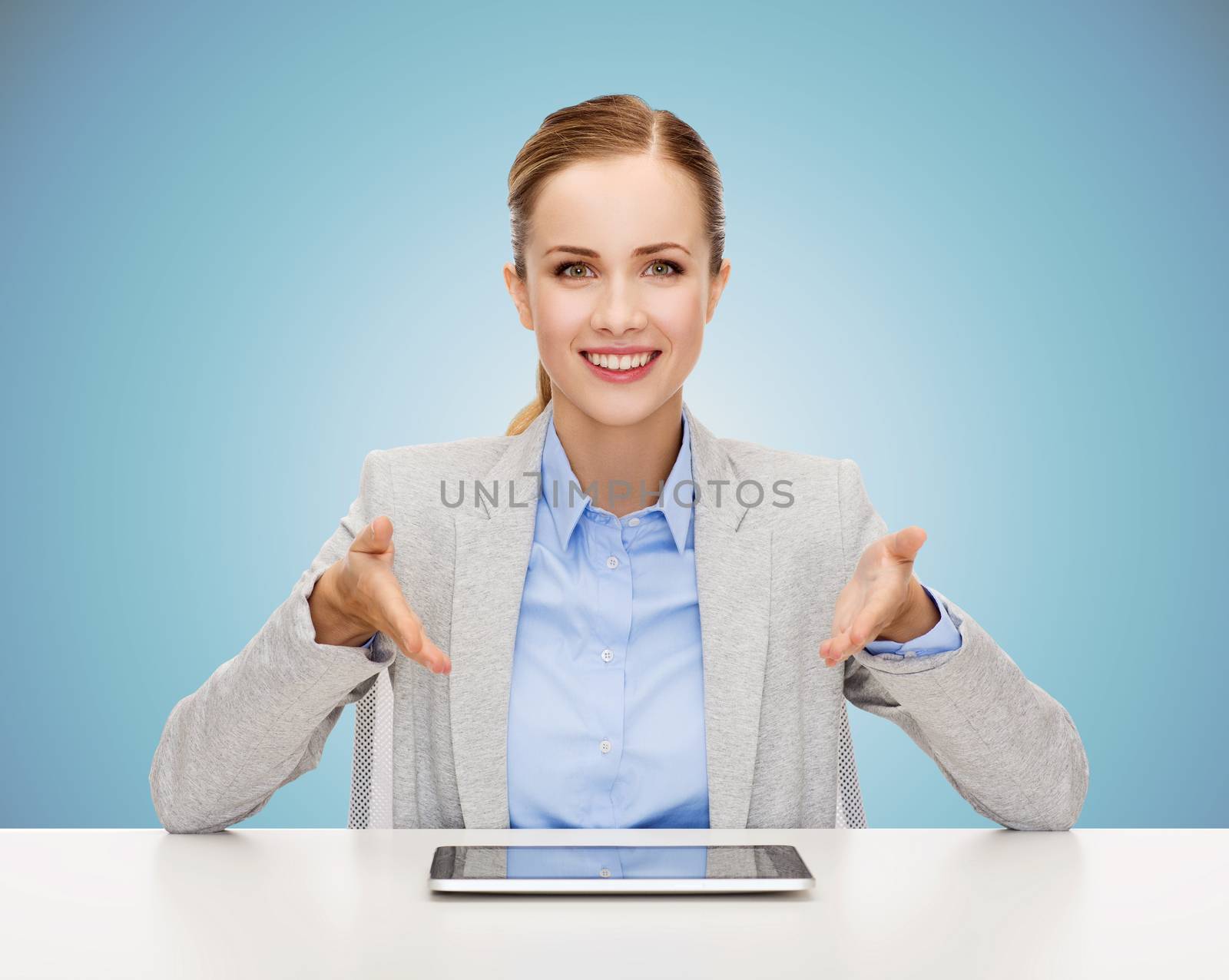 business woman with tablet pc sitting at table by dolgachov