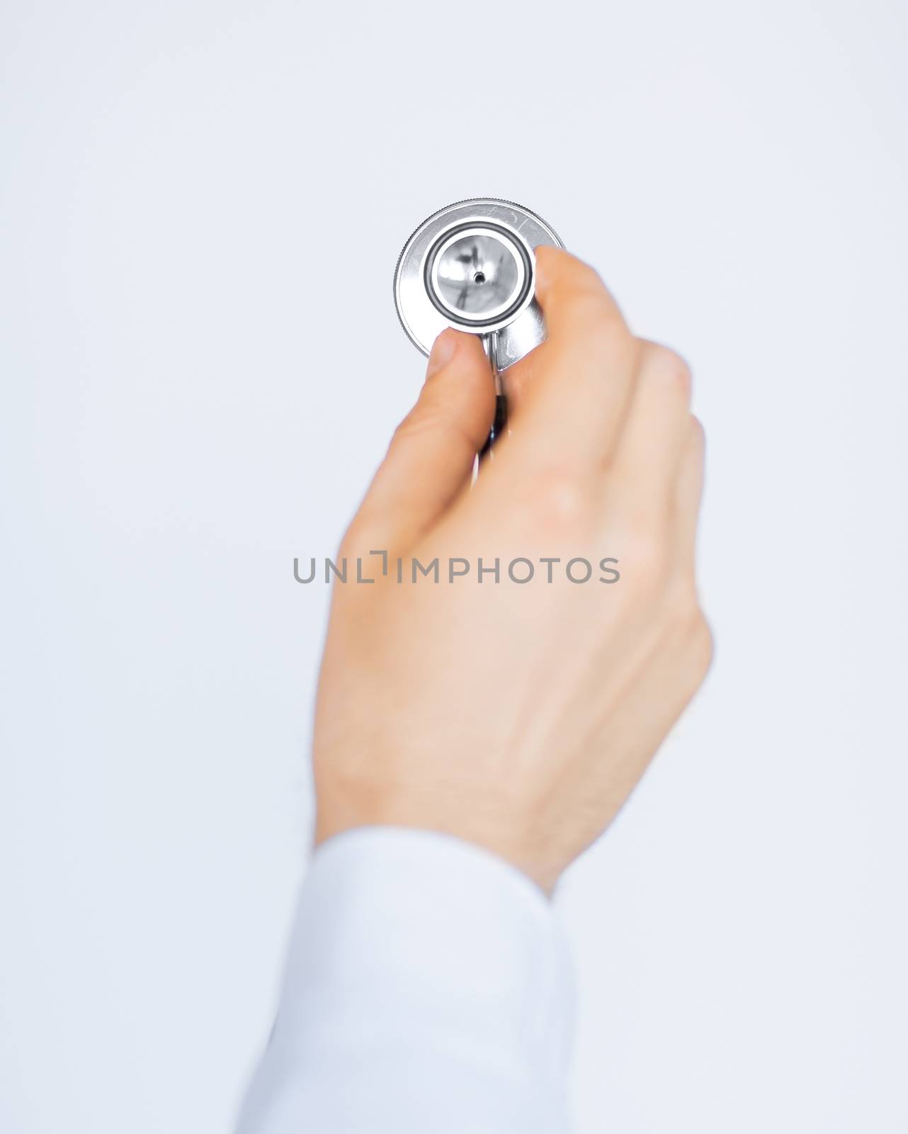 doctor hand with stethoscope listening somebody by dolgachov