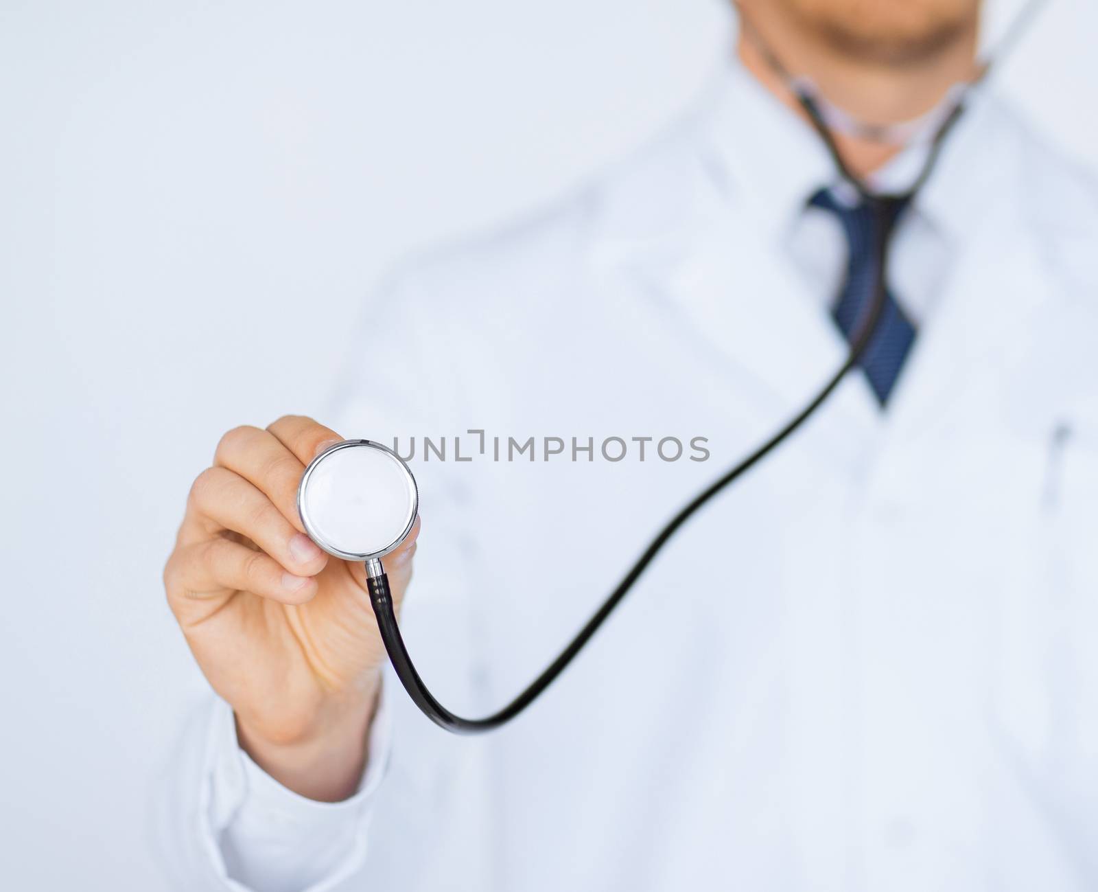 picture of doctor hand with stethoscope listening something