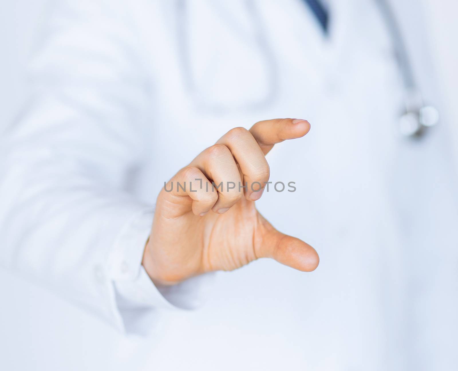 male doctor holding something in his hand by dolgachov