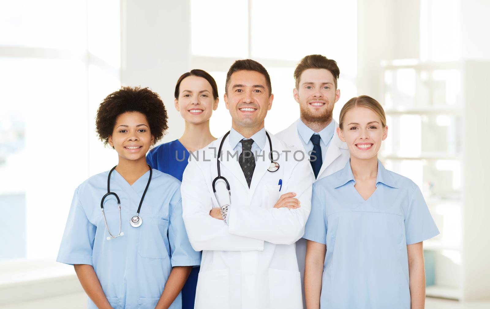 group of happy doctors at hospital by dolgachov