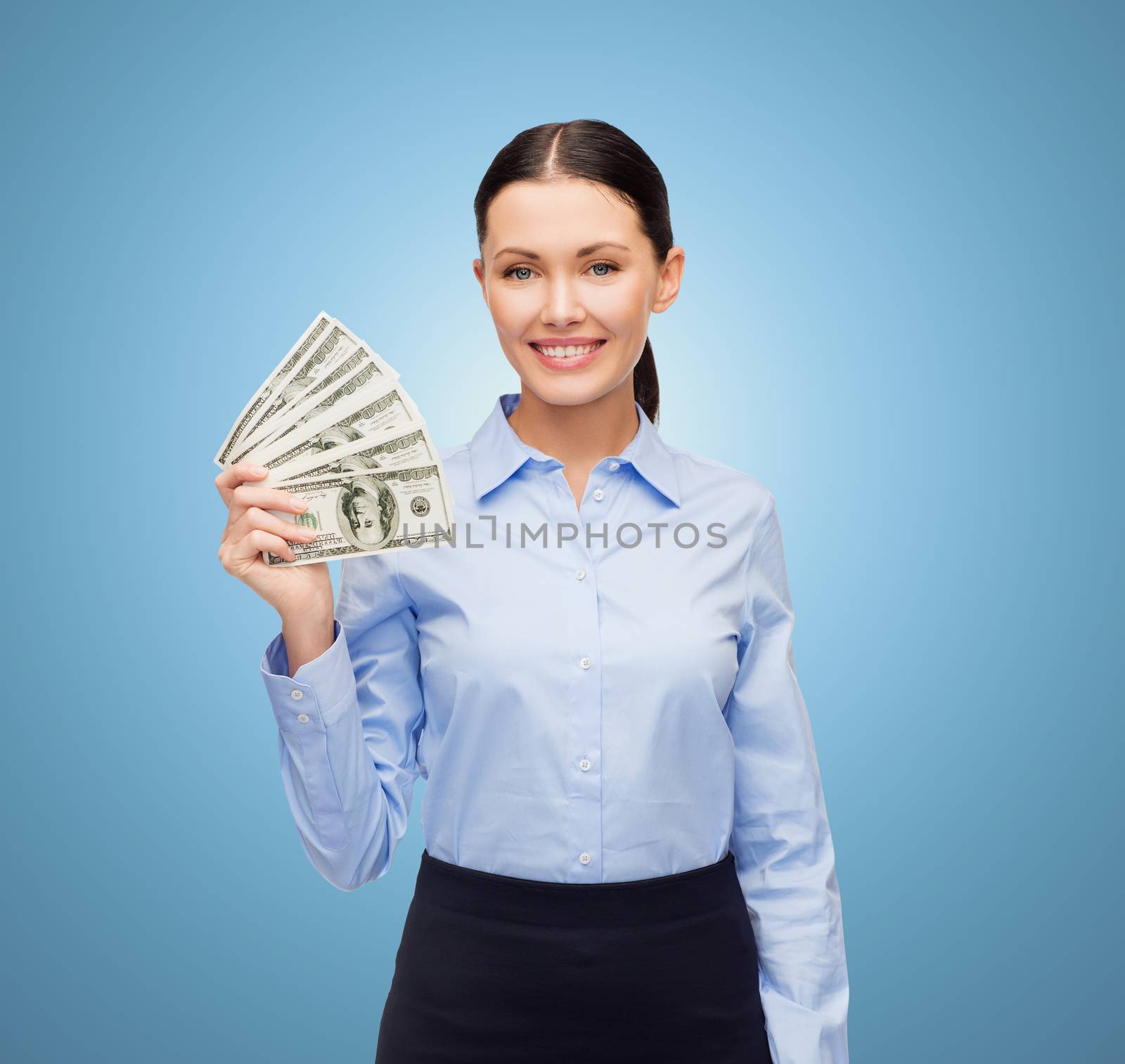 business and money concept - young businesswoman with dollar cash money over blue background