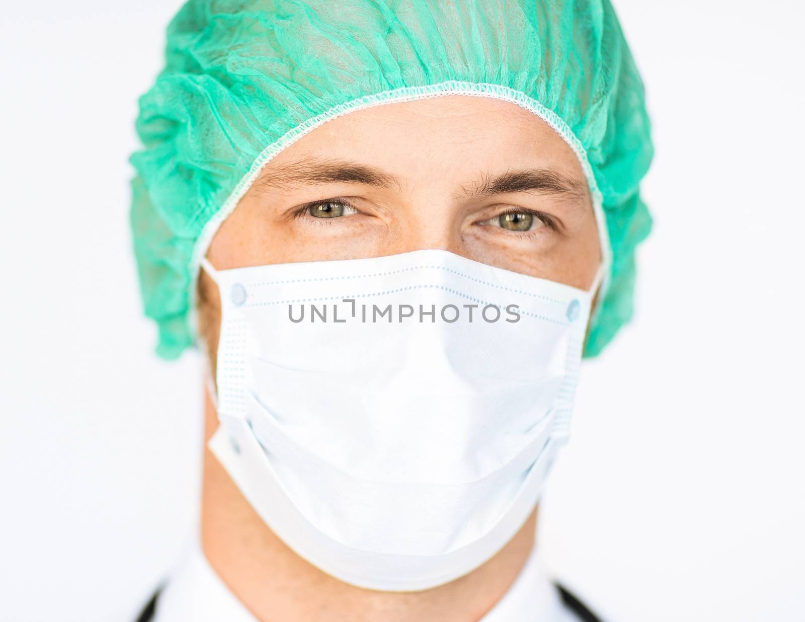 picture of half face of surgeon in medical cap and mask