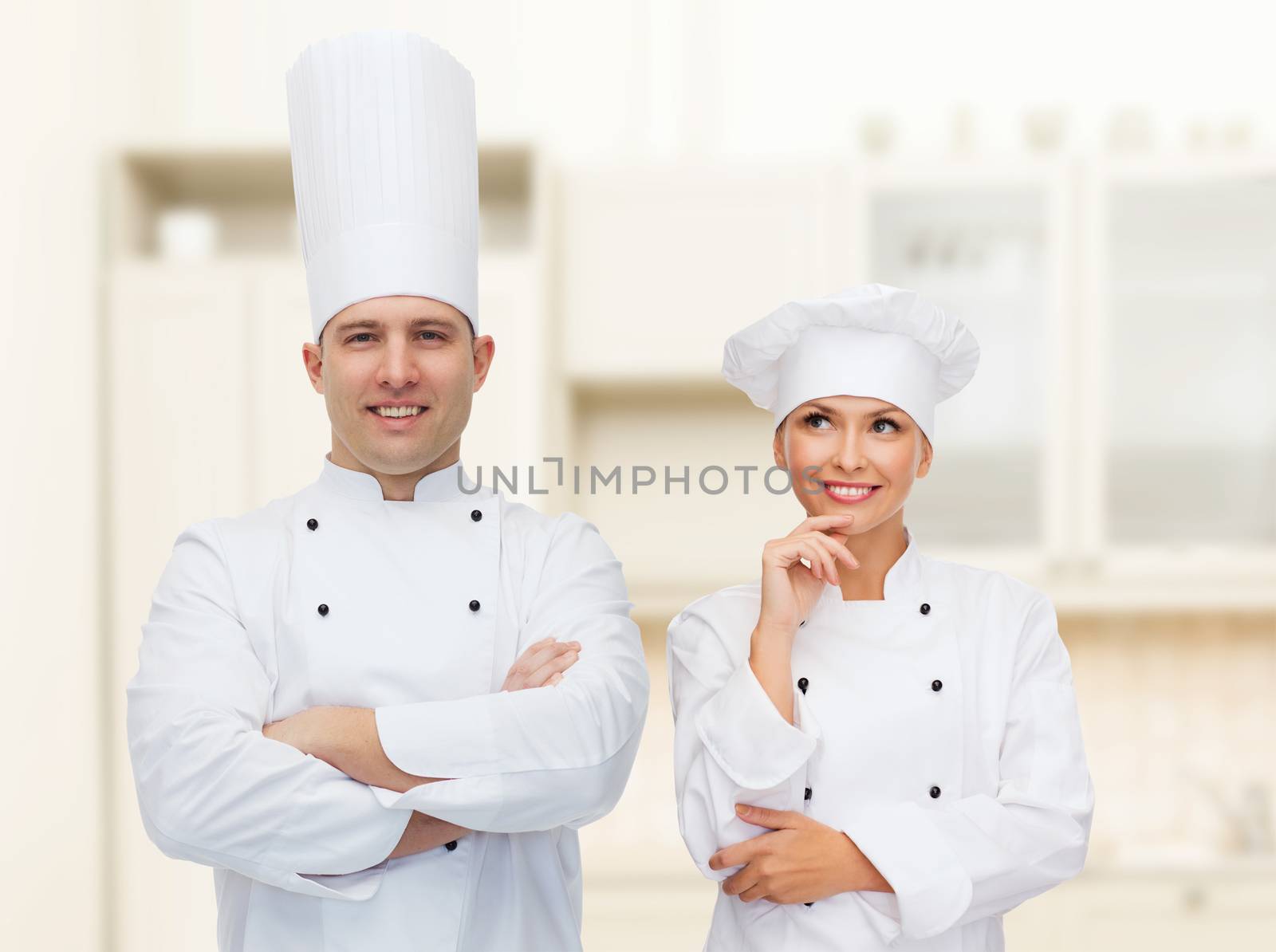 happy male chef cook with crossed hands by dolgachov