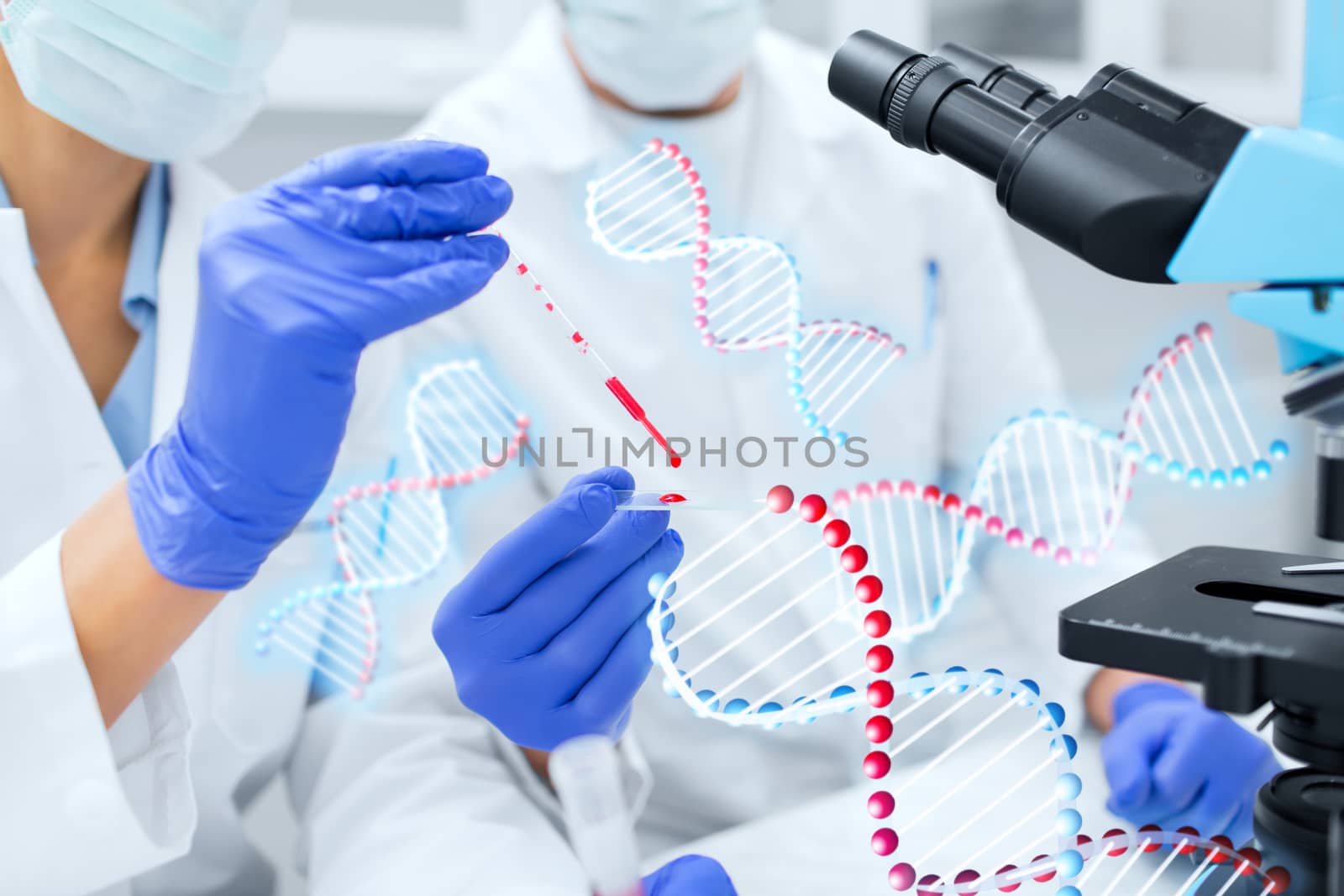 close up of scientists filling perti dish in lab by dolgachov