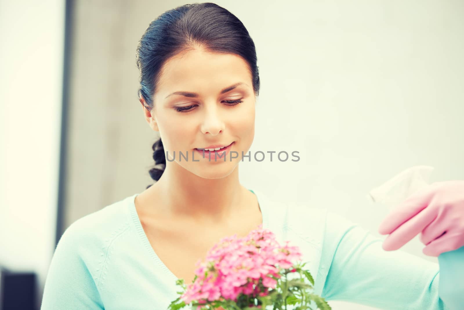 bright picture of lovely housewife with flower.