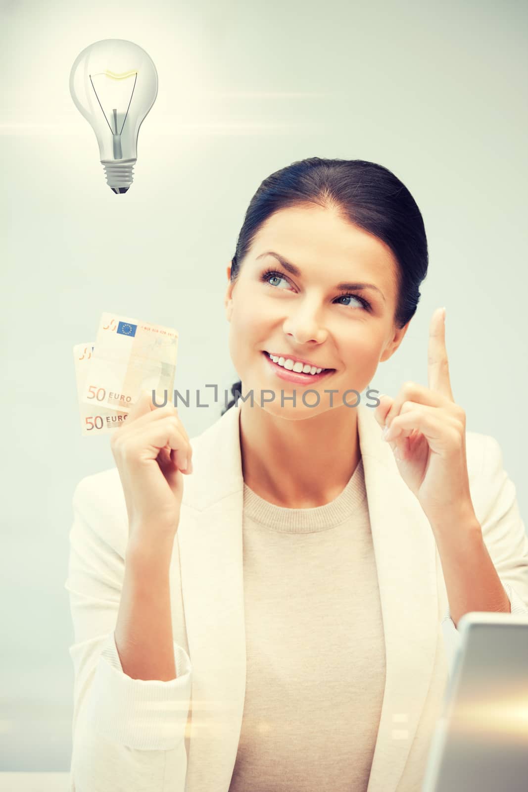 happy woman with cash euro money and light bulb