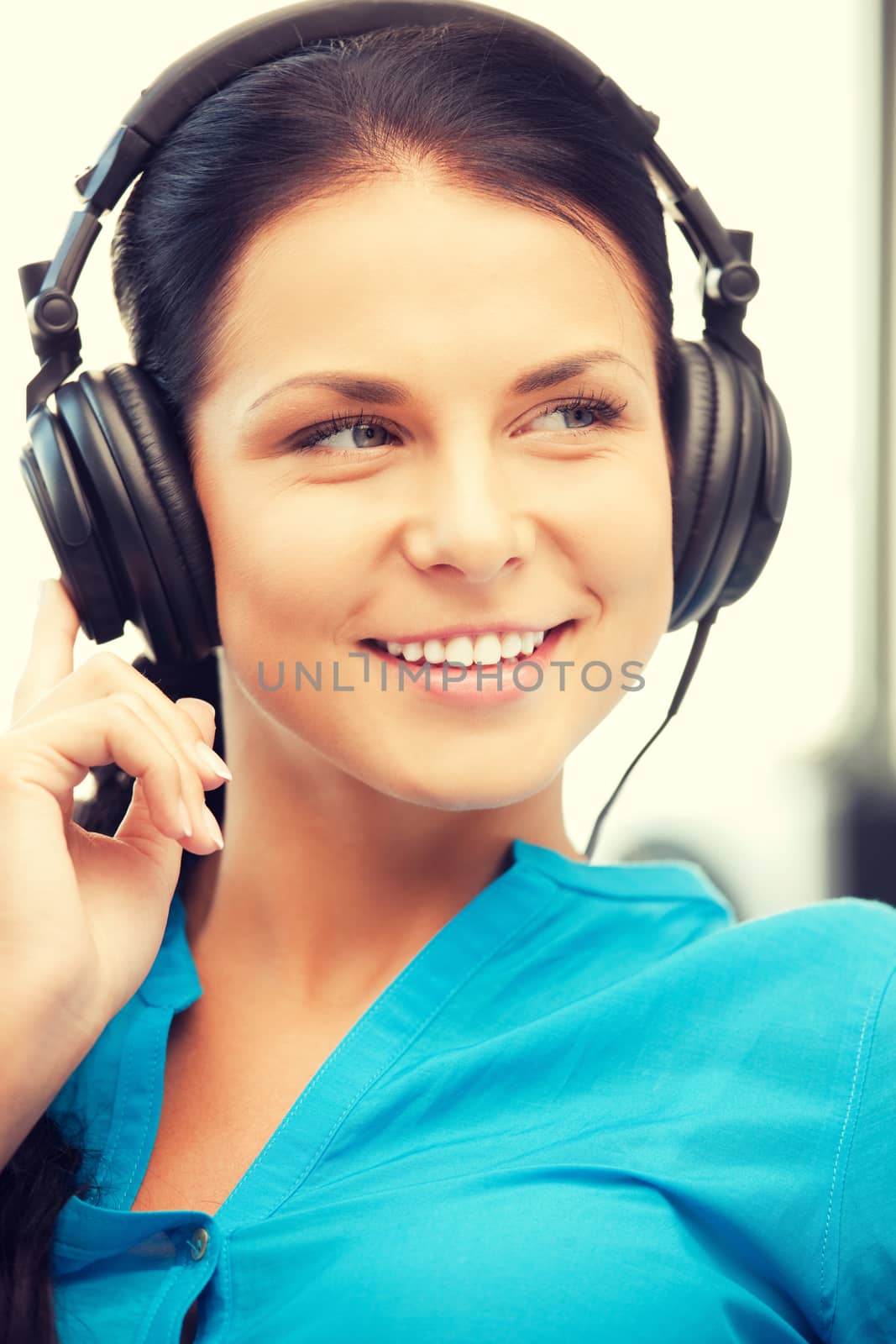 picture of happy teenage girl in big headphones