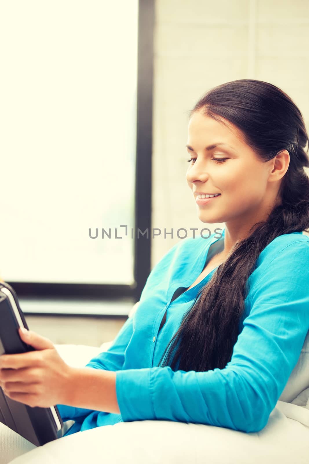 happy woman with tablet pc computer by dolgachov