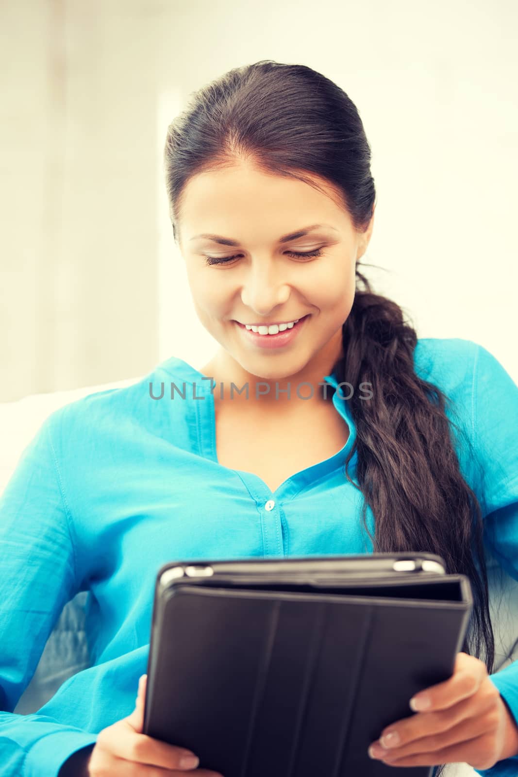 happy woman with tablet pc computer by dolgachov