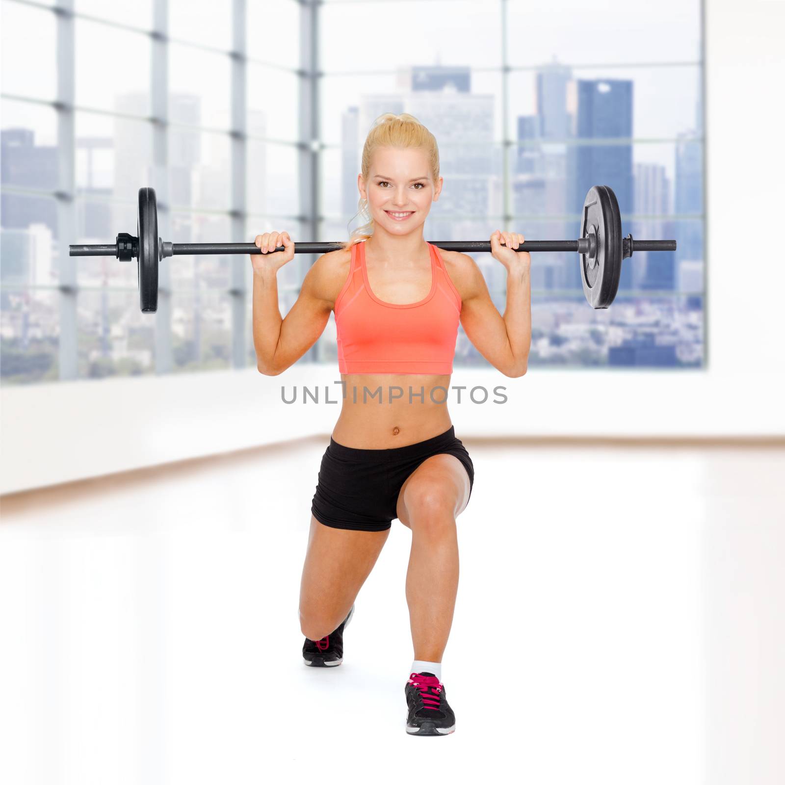 fitness, sport, weightlifting and people concept - sporty woman exercising with barbell over gym background