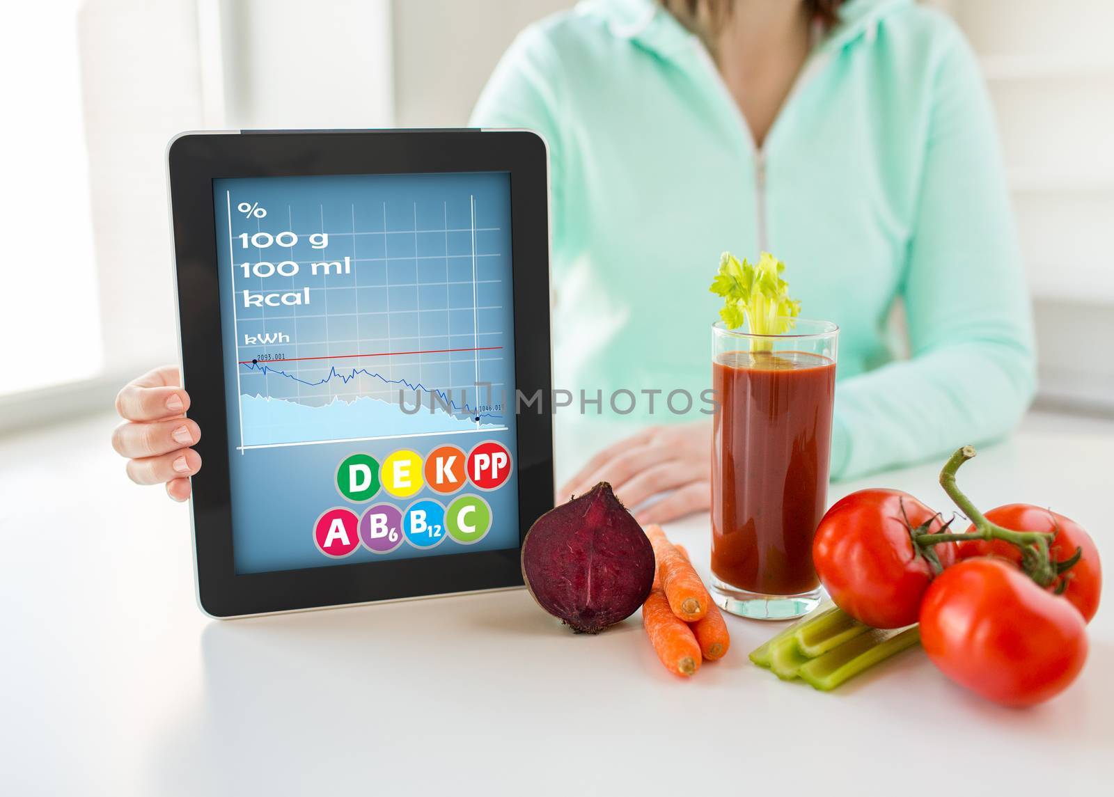 close up of woman with tablet pc and vegetables by dolgachov