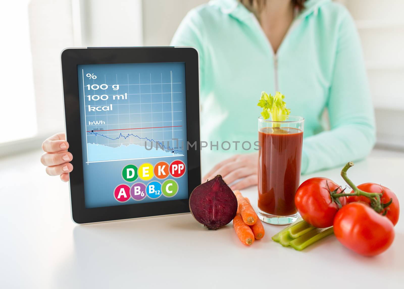 healthy eating, technology, diet and people concept - close up of woman hands holding tablet pc computer with calories and vitamins chart, vegetables