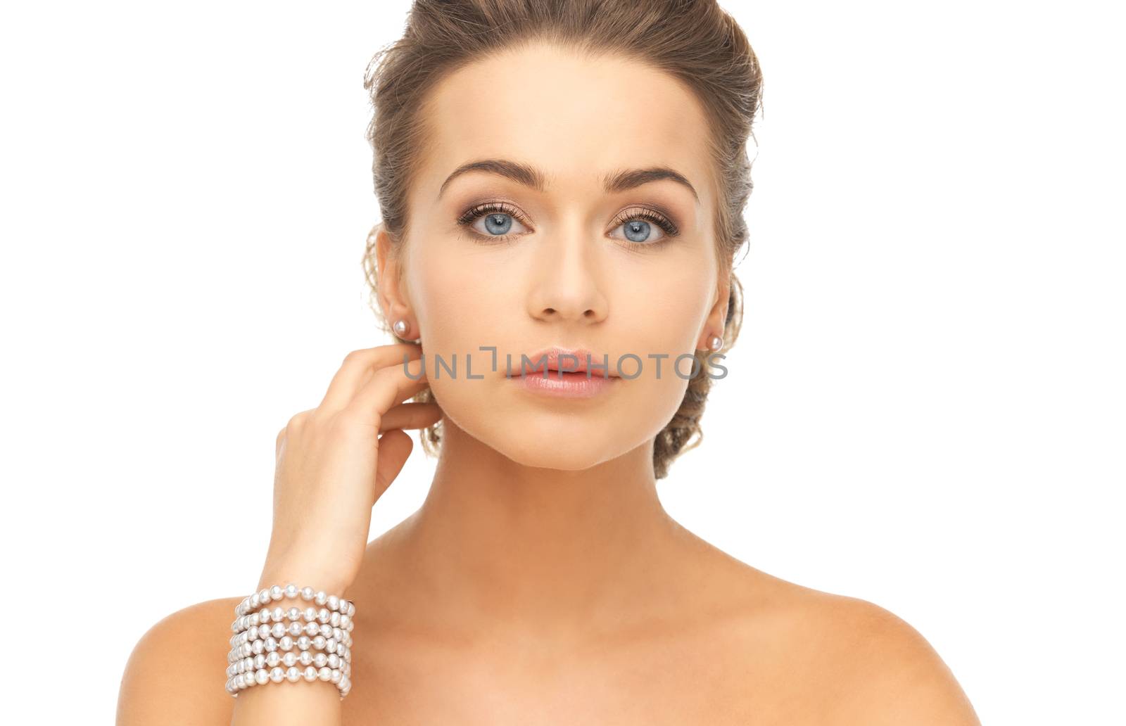 woman with pearl earrings and bracelet by dolgachov