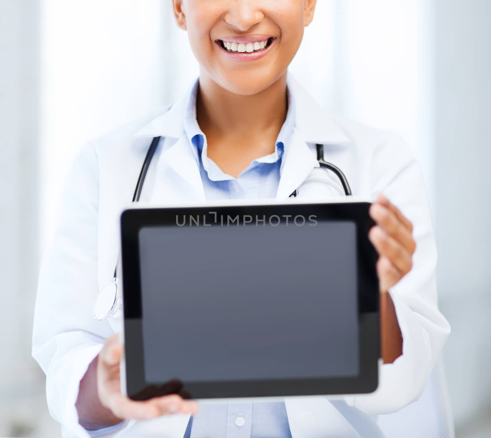 african female doctor with tablet pc by dolgachov