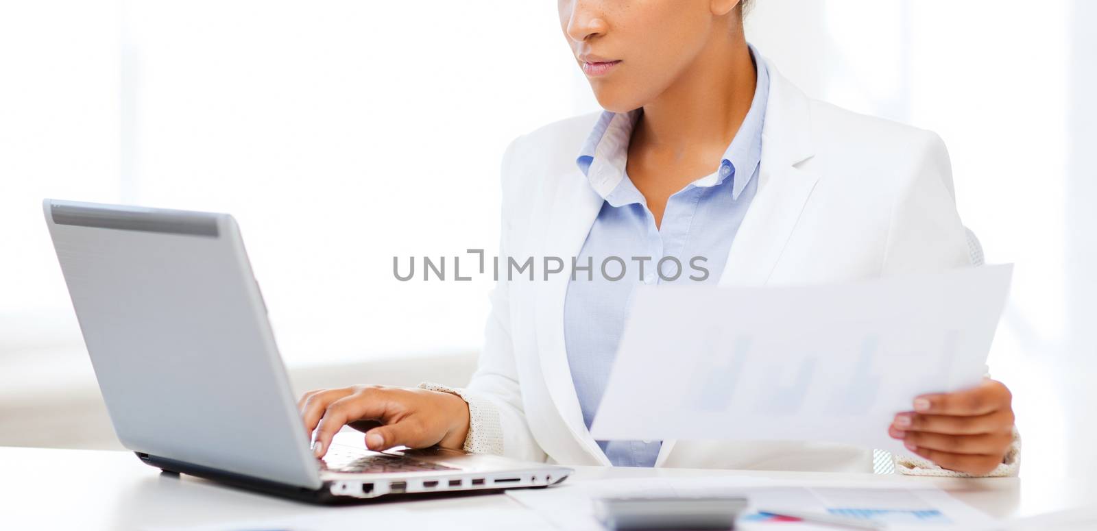 businesswoman working with computer in office by dolgachov