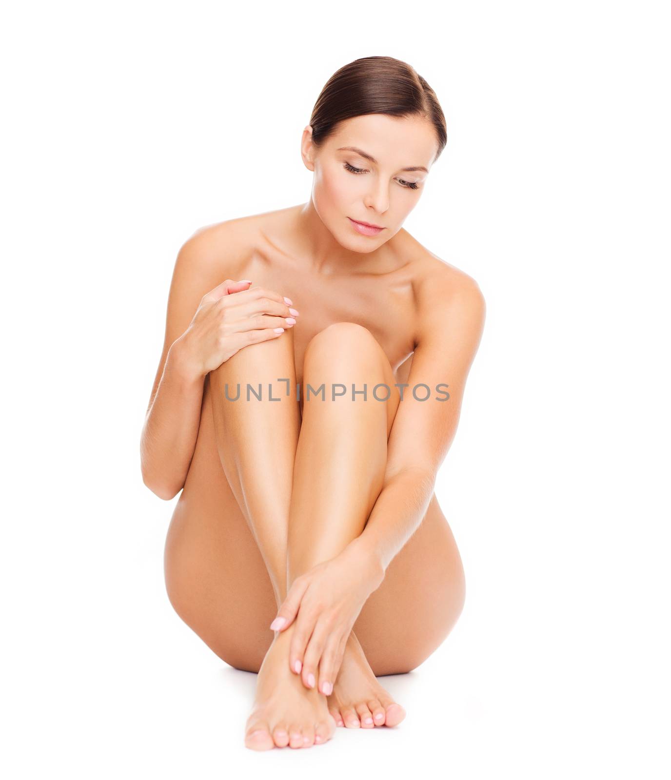 beautiful naked woman touching her legs by dolgachov